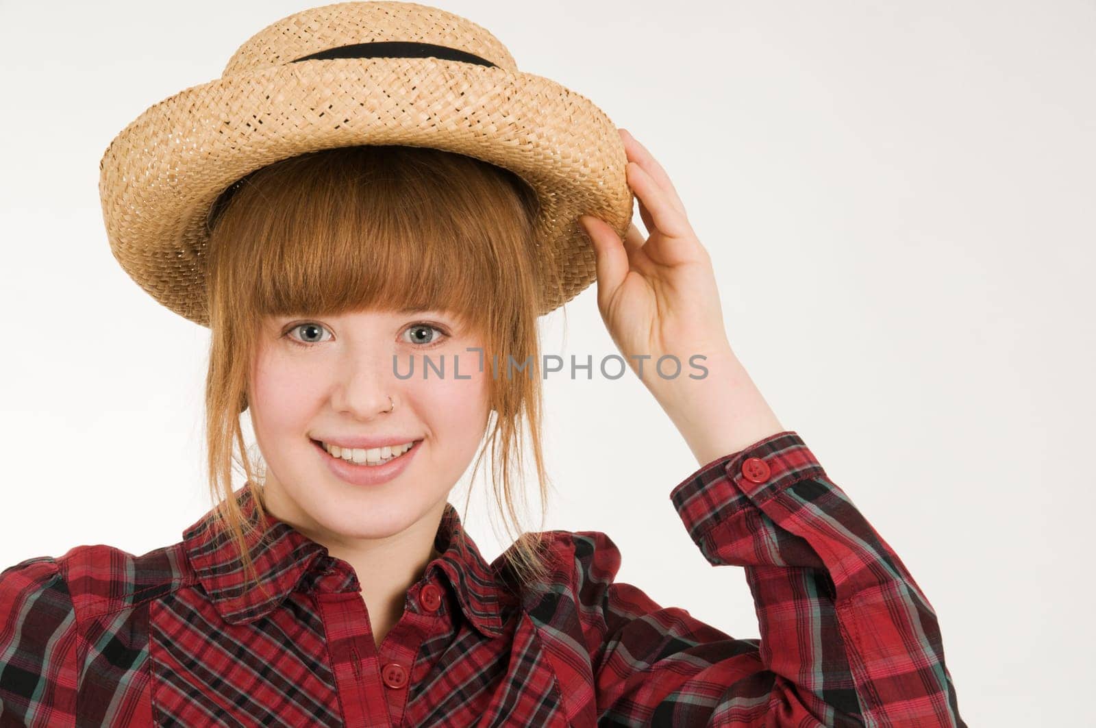 girl with hand on hat horizontal
