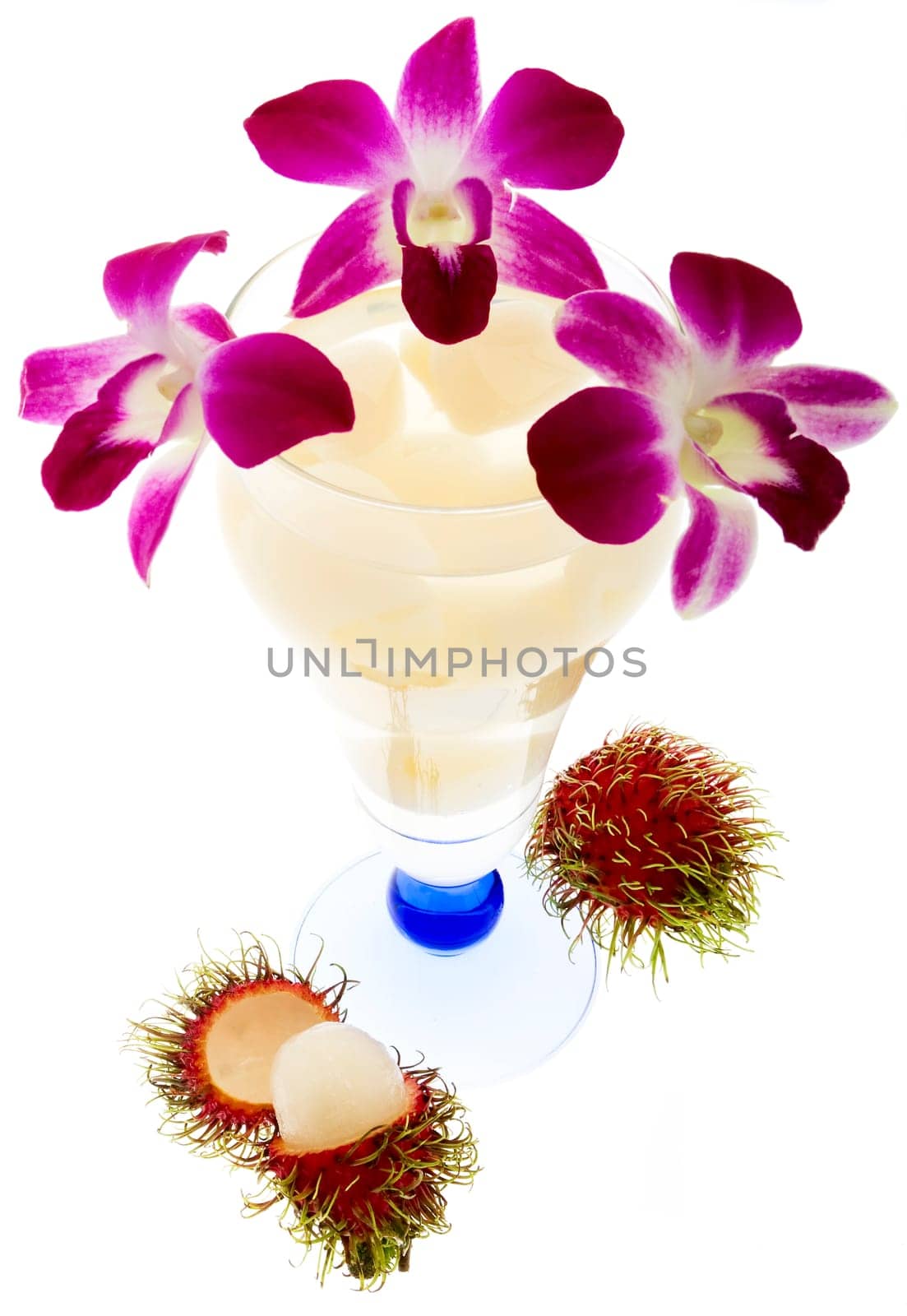 Rambutan with fruit juice and orchid
