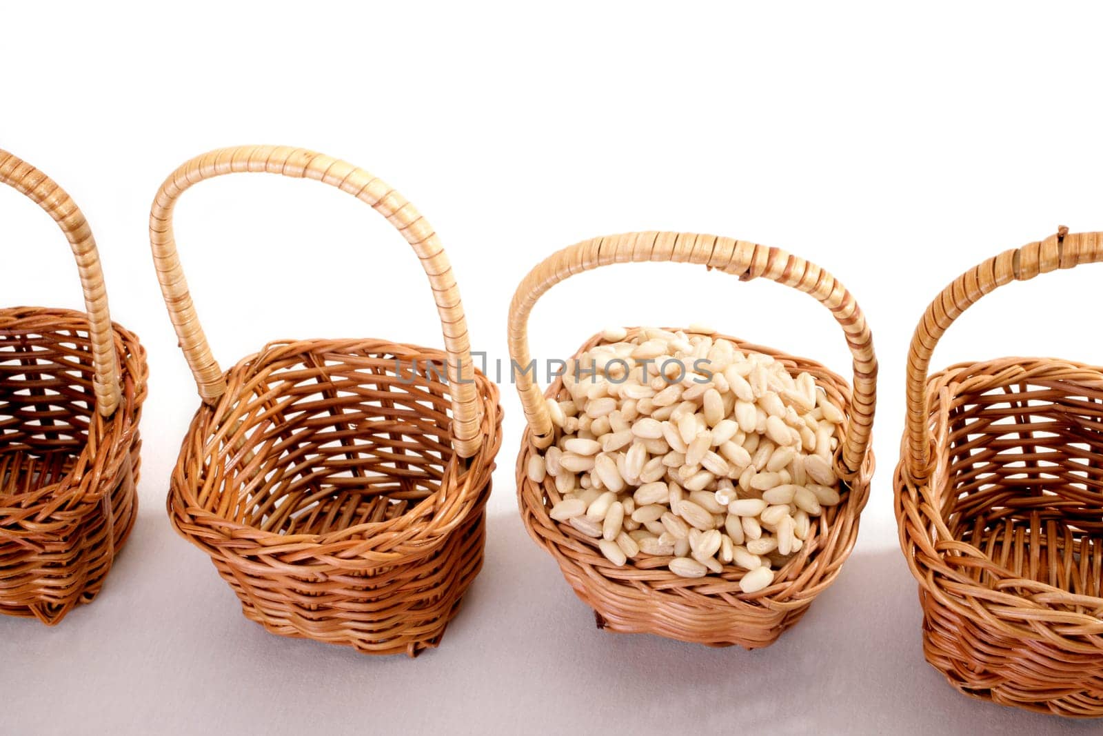wheat grain in a basket on white