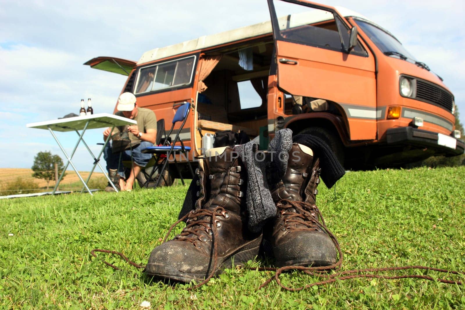 Hiking boots in front of camper van