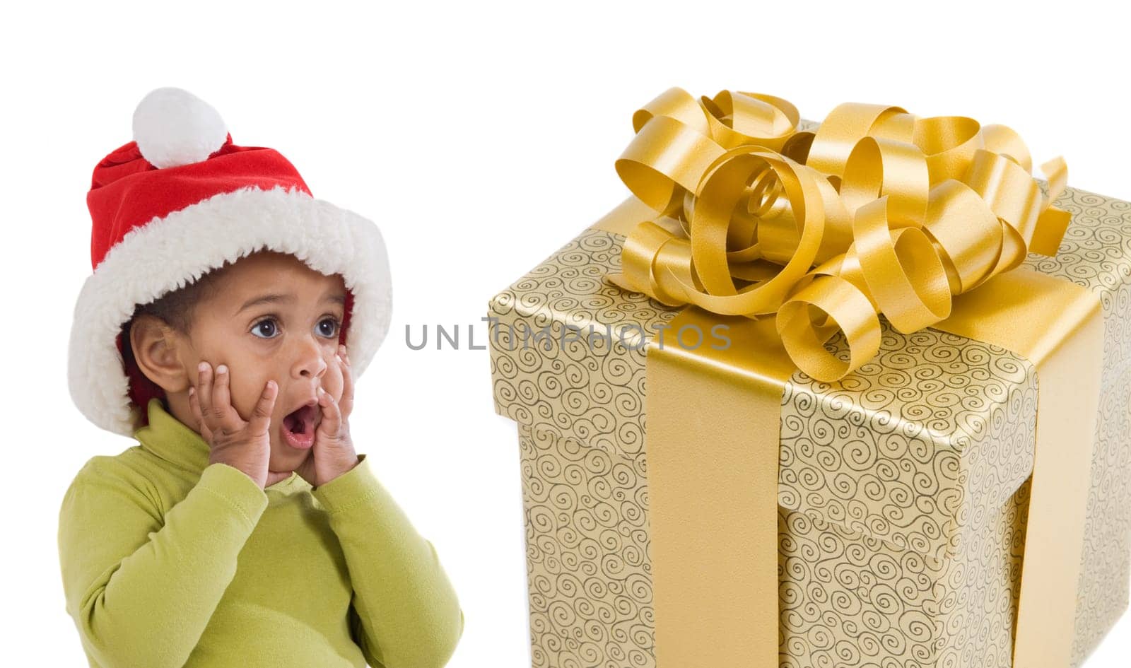 Surprised baby girl with a gift of xmas