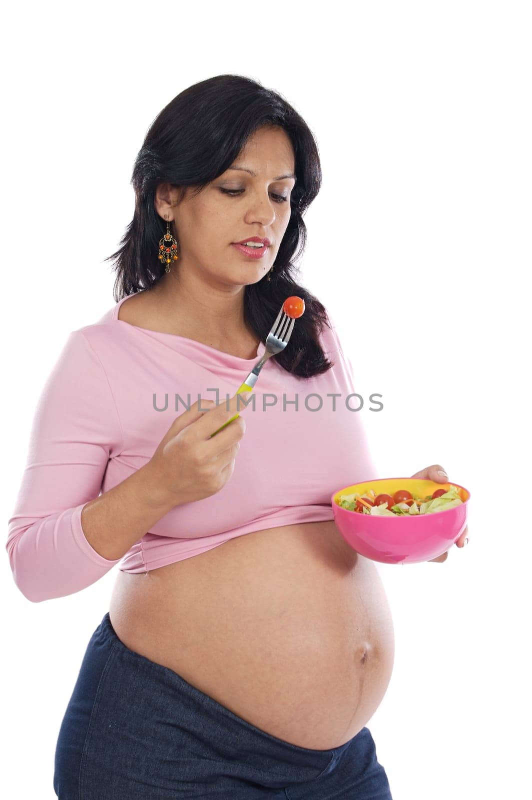 Beautiful pregnant eating salad