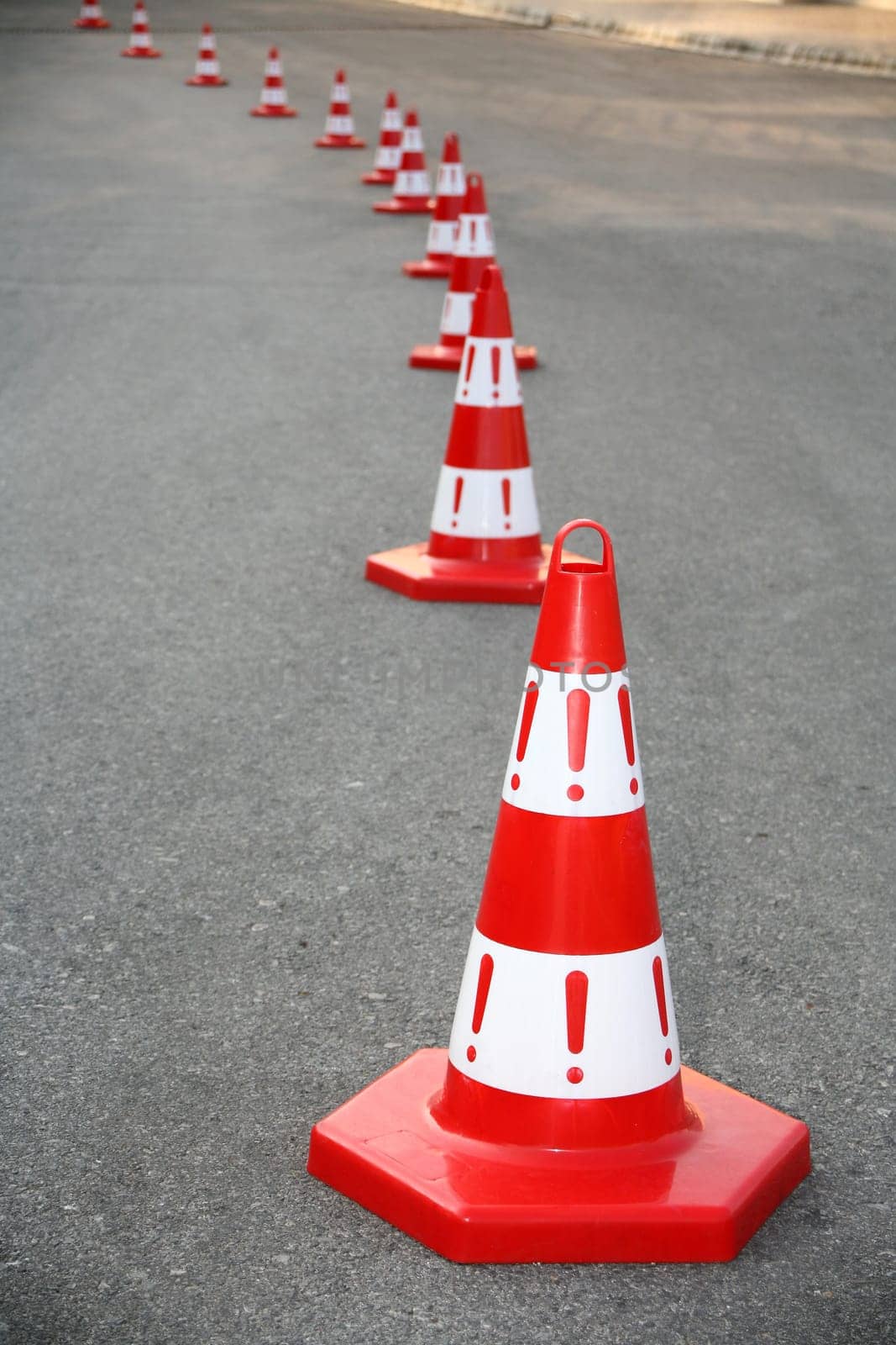 An image of cautions on asphalt road