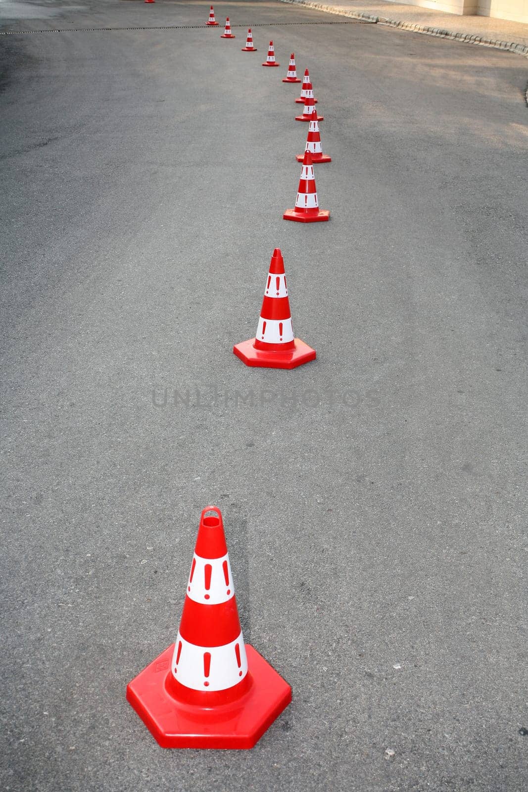 An image of cautions on asphalt road