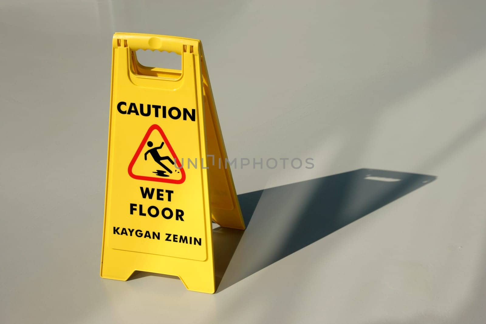 An image of yellow wet floor caution