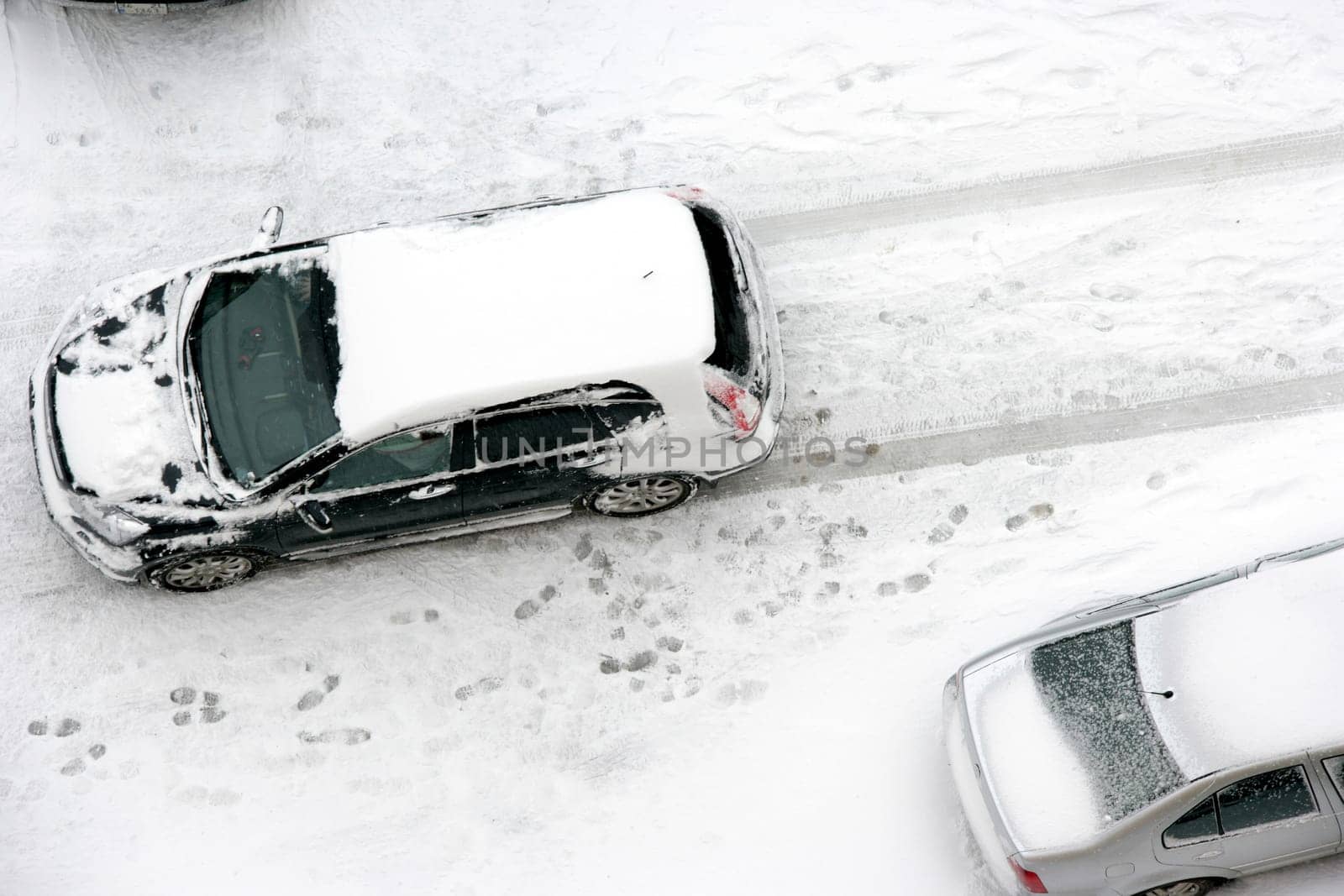 cars covered with snow in winter time