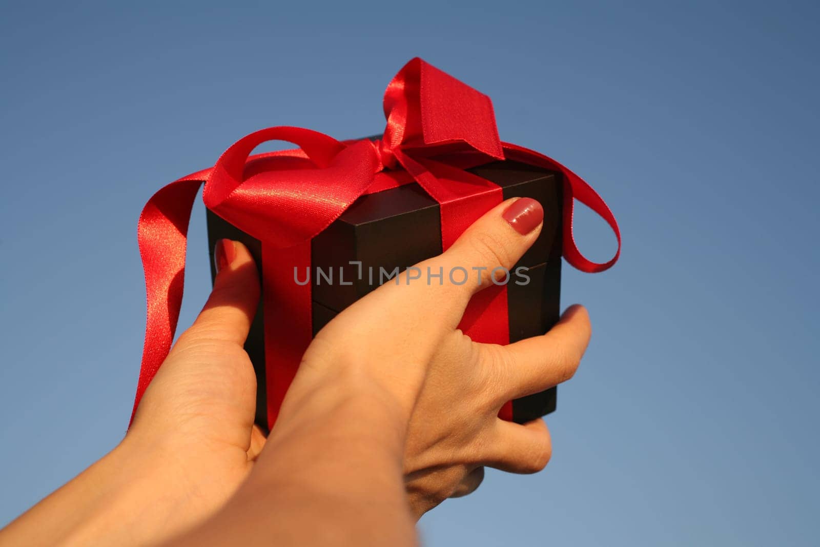 close up shot of black giftbox in hand