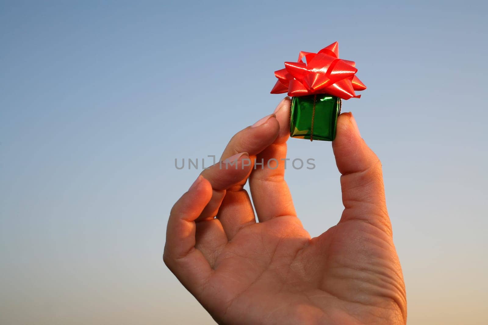 close up shot of green giftbox in hand