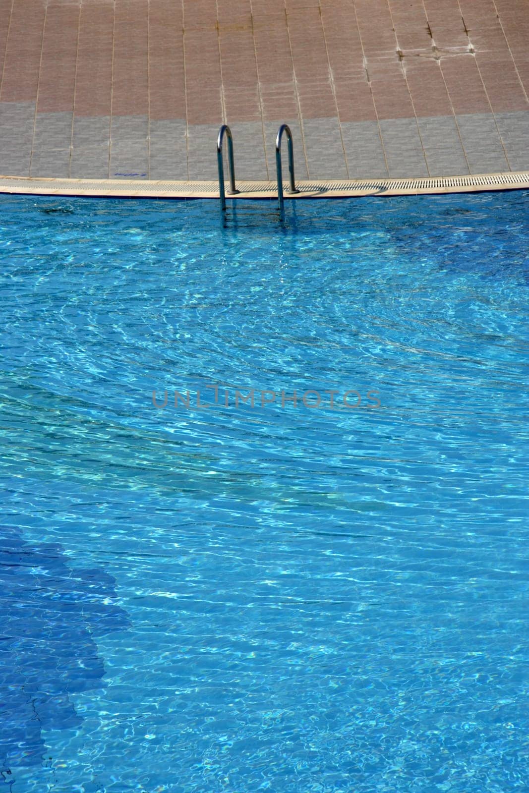 blue swimming pool in summer