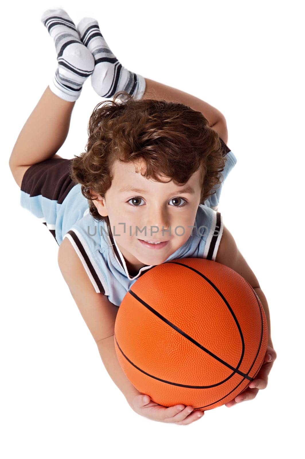 Beautiful boy playing basketball