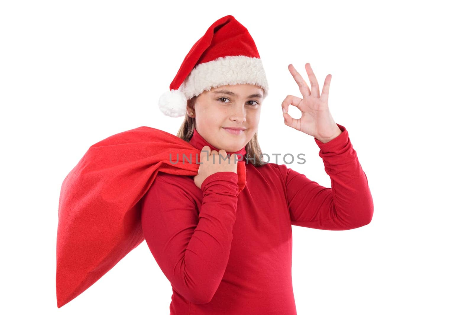 Beautiful girl in christmas saying OK