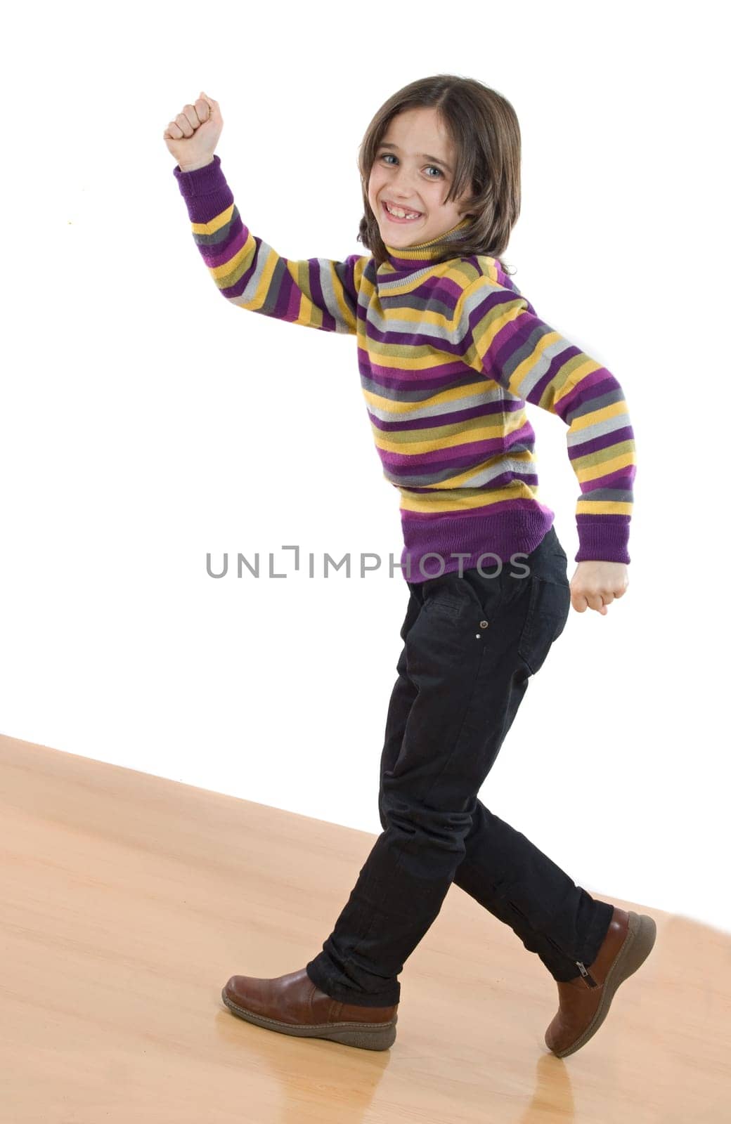 Joyful little girl walking