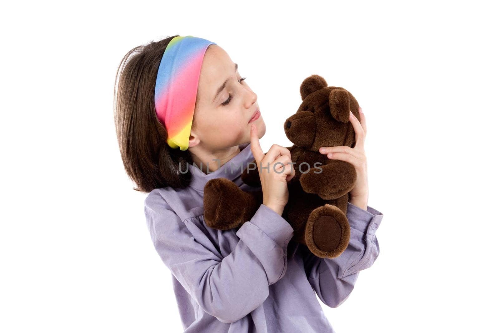 Pretty girl scolding teddy bear