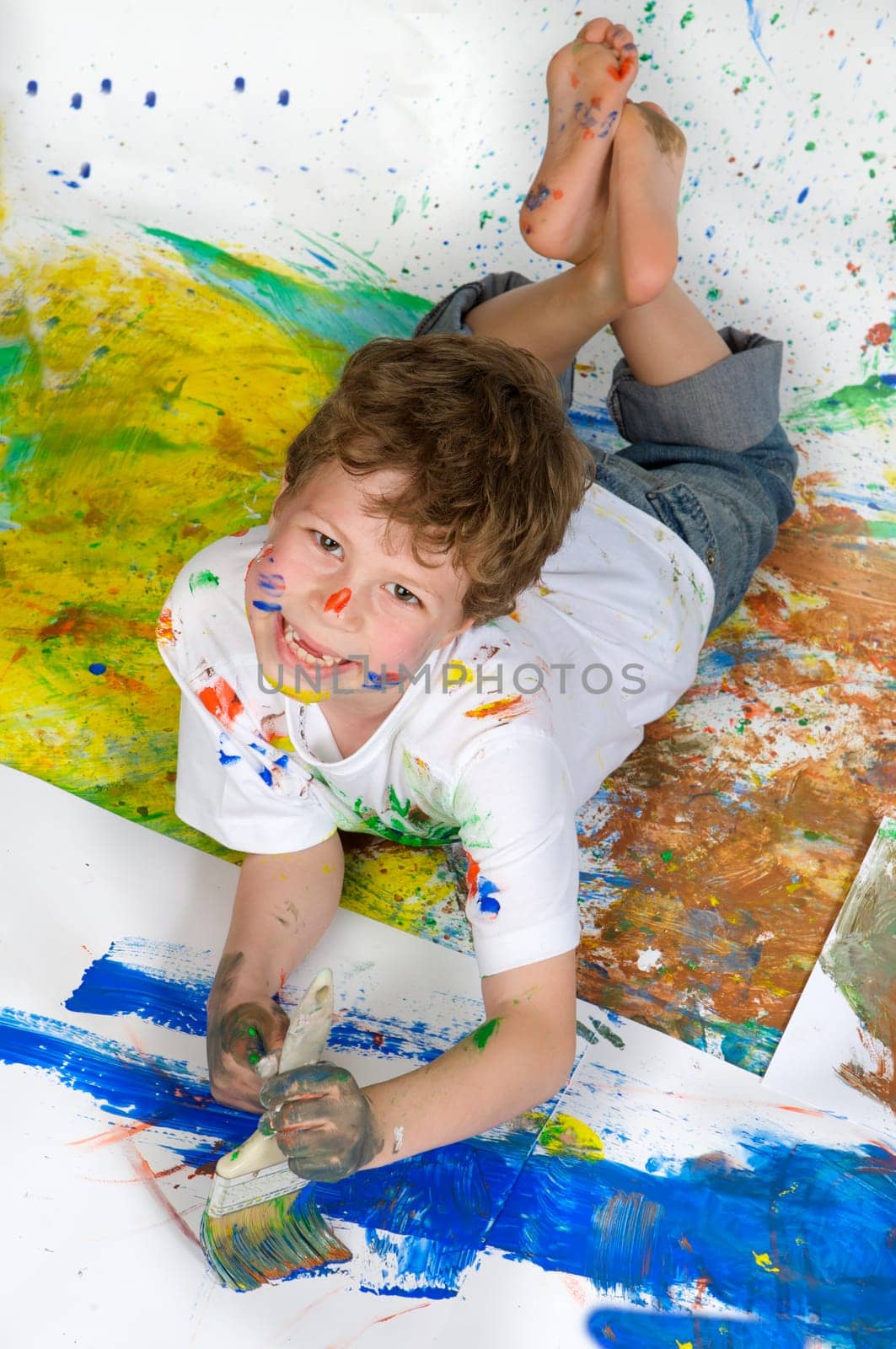 Boy playing with painting