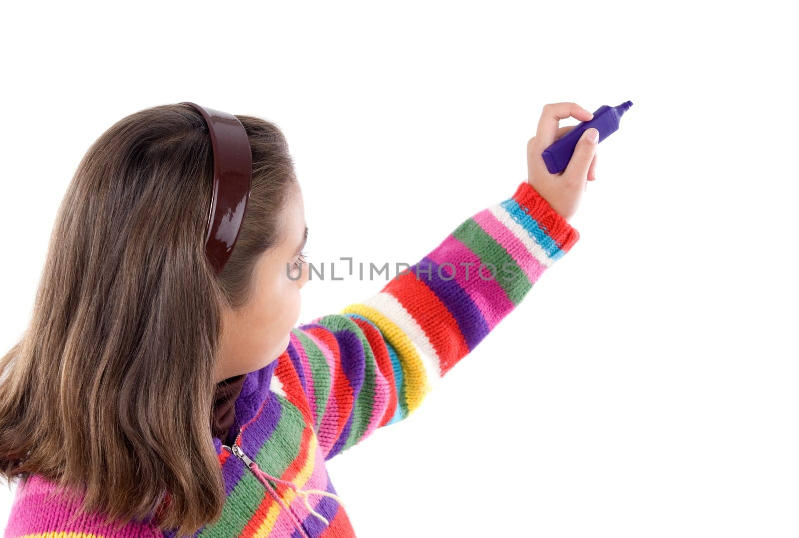 Adorable girl writing with fluorescent