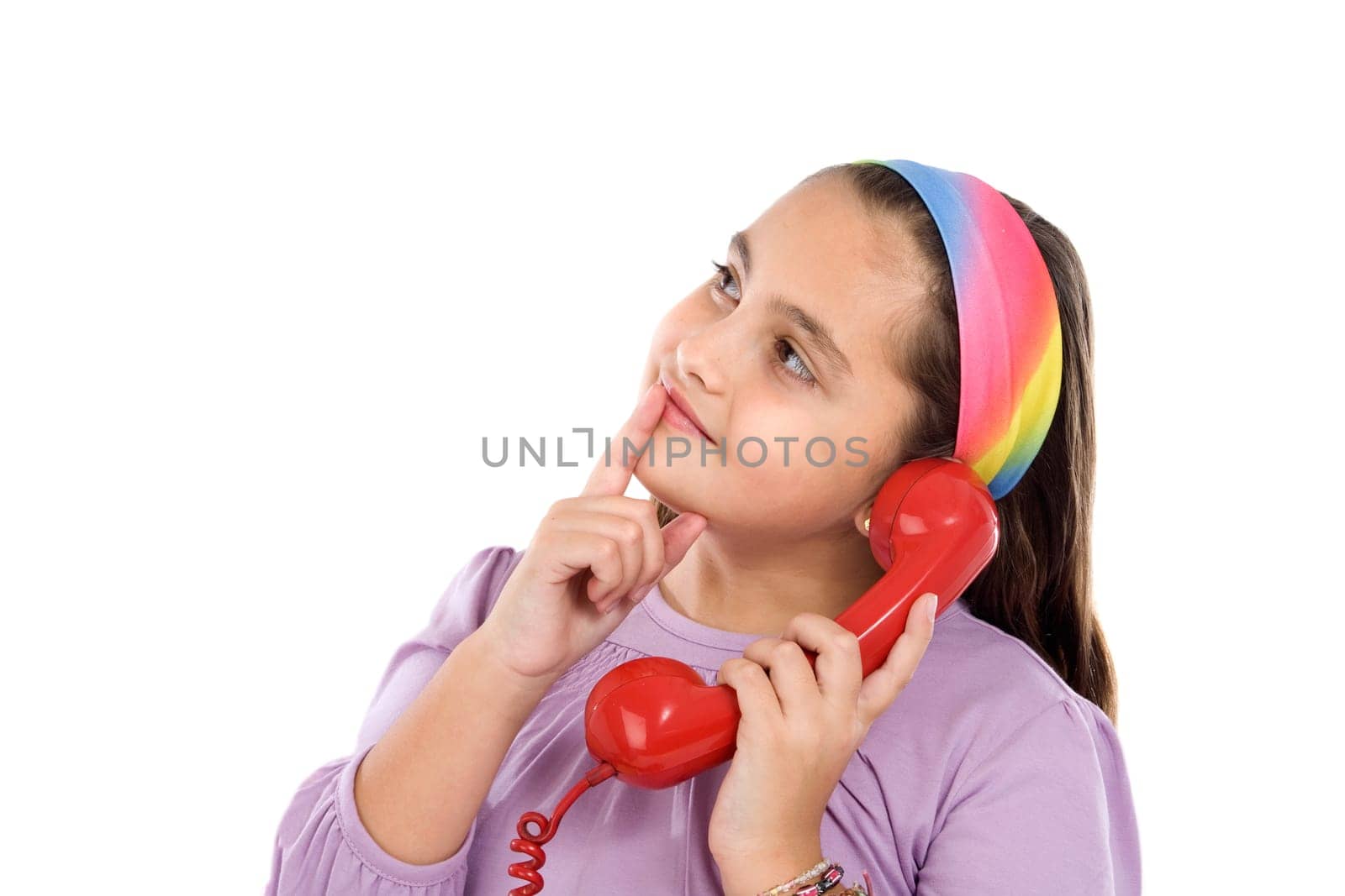 Beautiful girl with red phone thinking