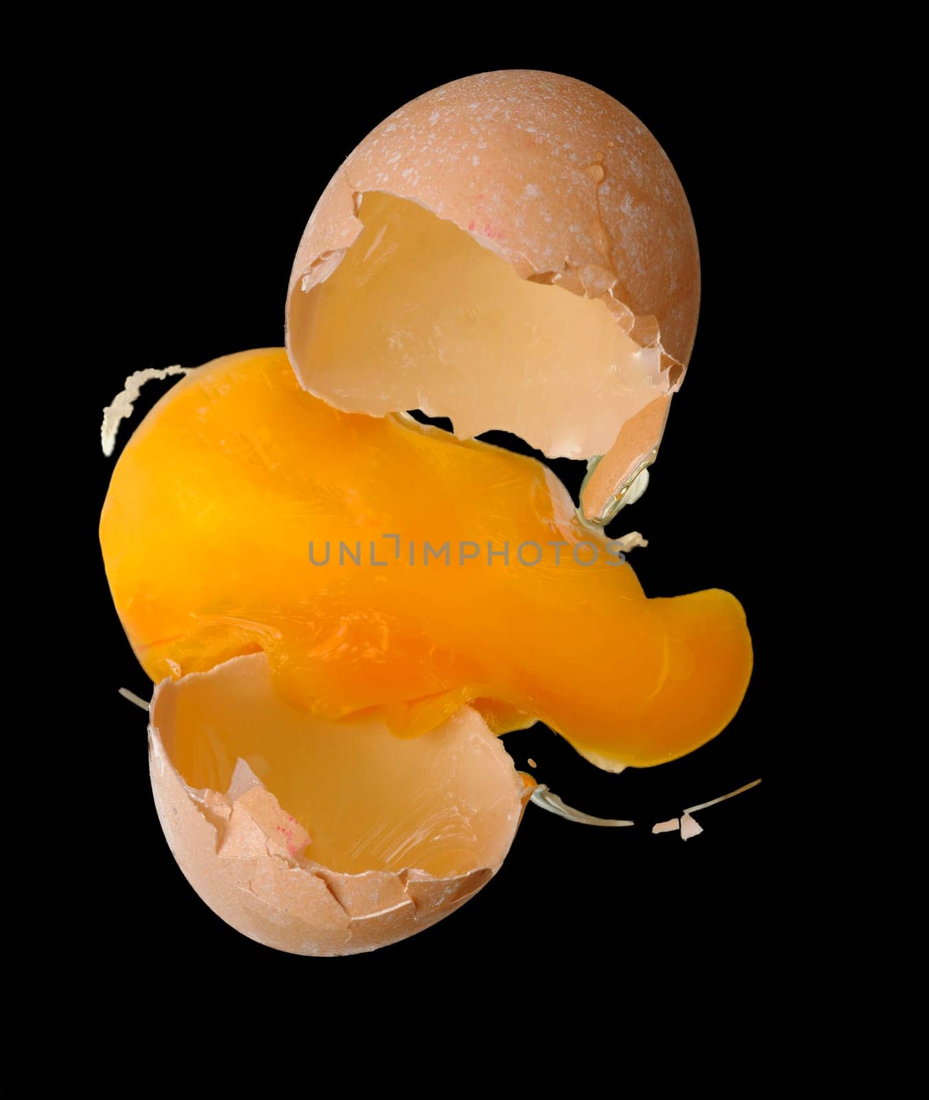 broken egg on the black background