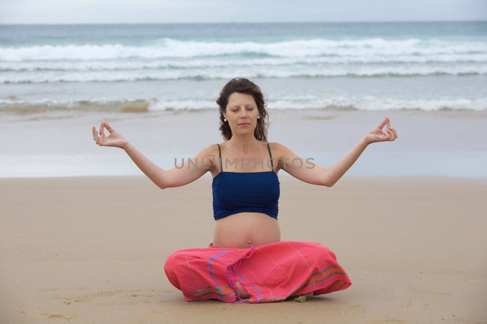 Beautiful pregnant girl practicing yoga
