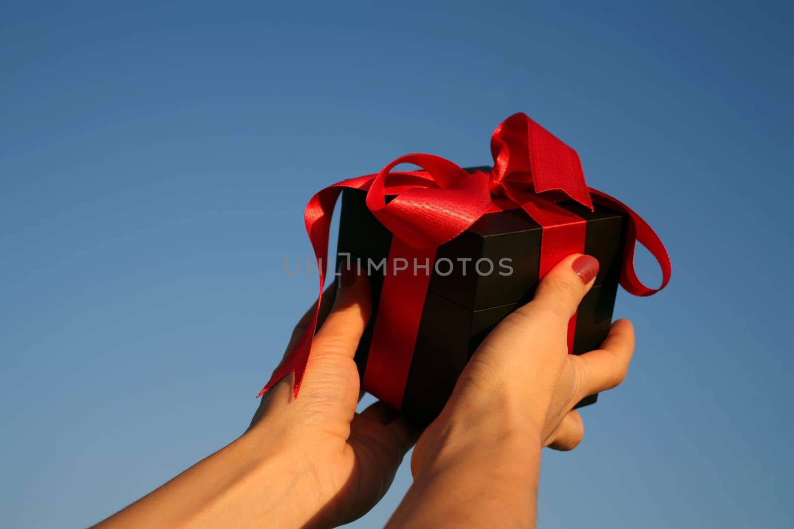 black giftbox in hand