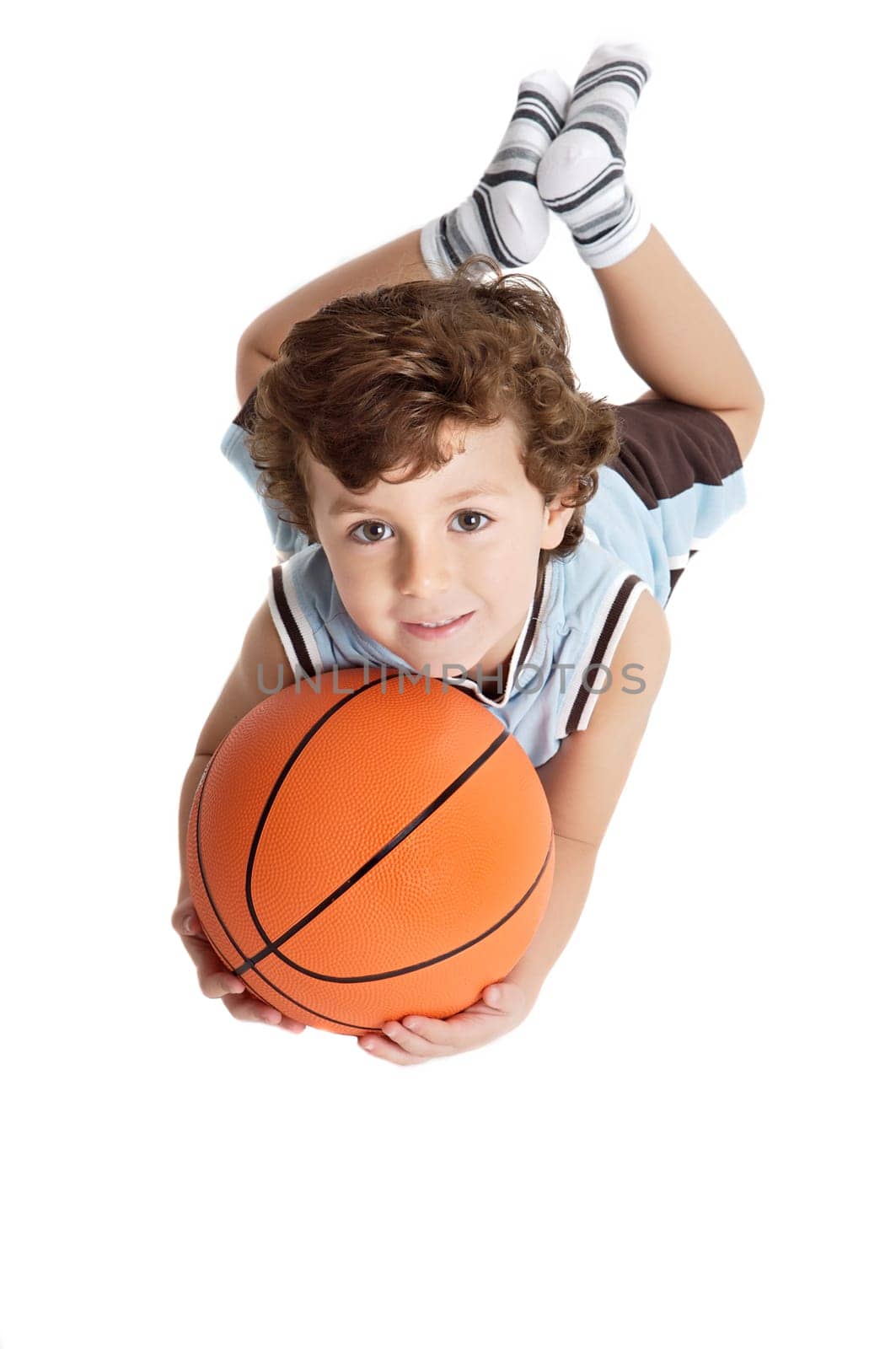 adorable boy playing the basketball