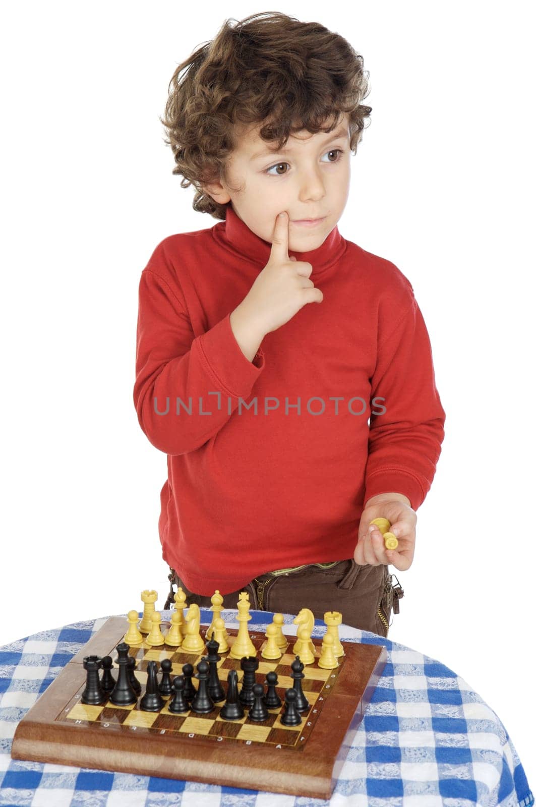Adorable boy playing the chess