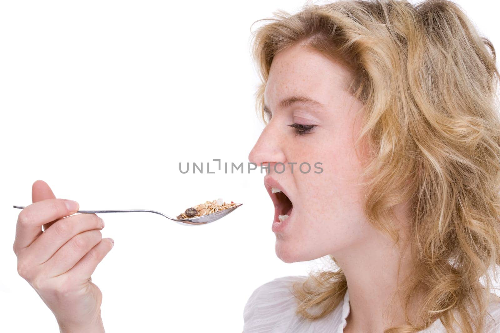 Young woman eating cereal