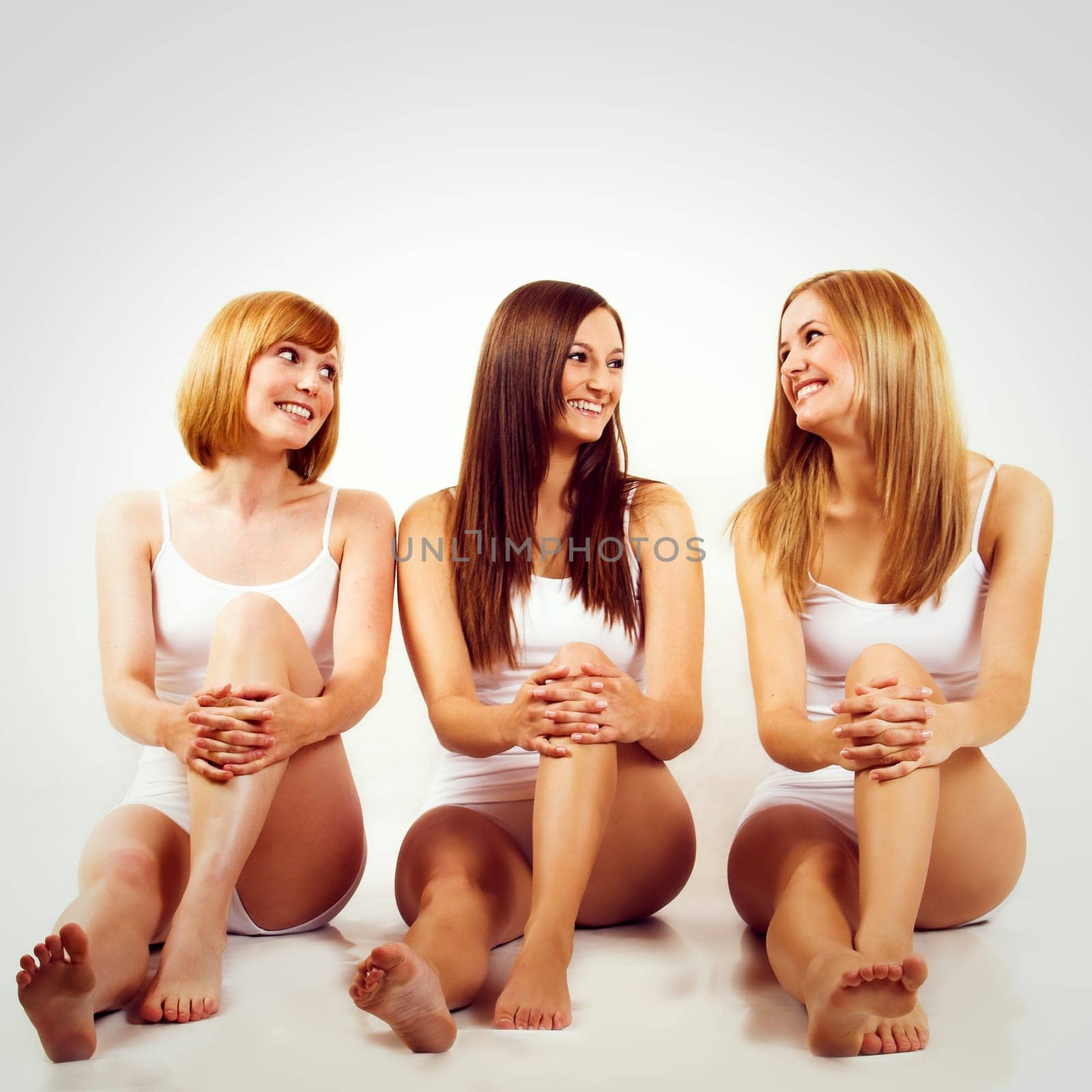 Three young women in white underwear