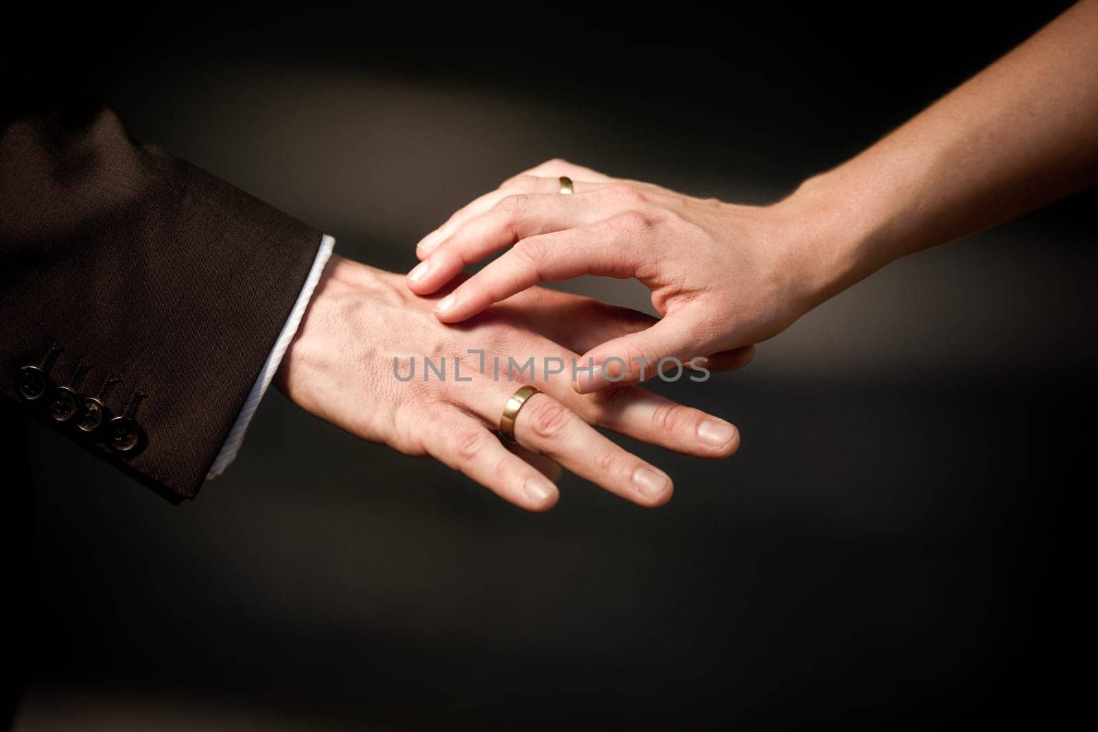 Hand in hand with wedding ring