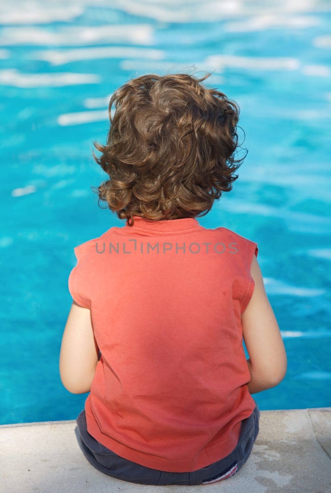 adorable boy watching water