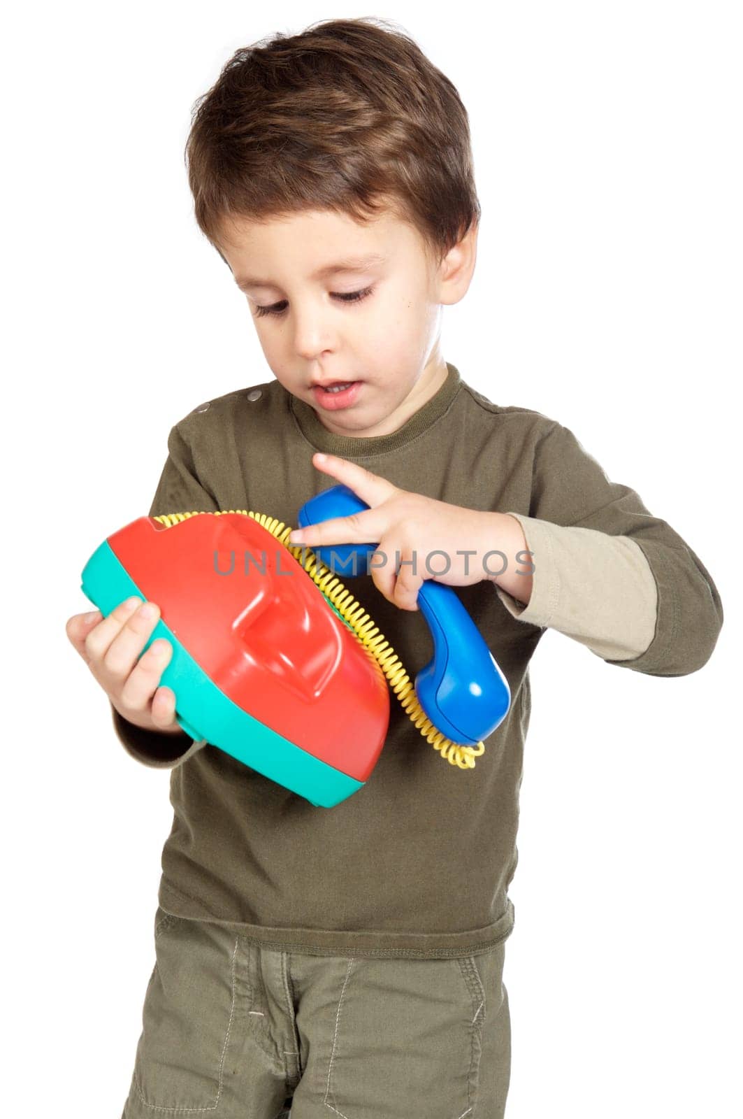 adorable boy speaking on the telephone