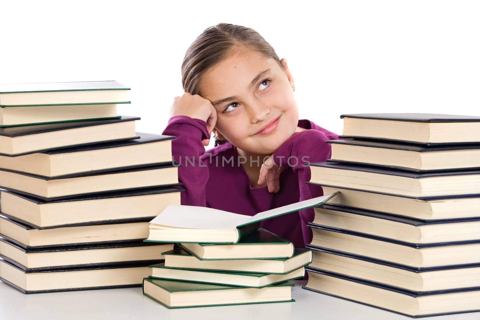 Adorable girl with many books thinking