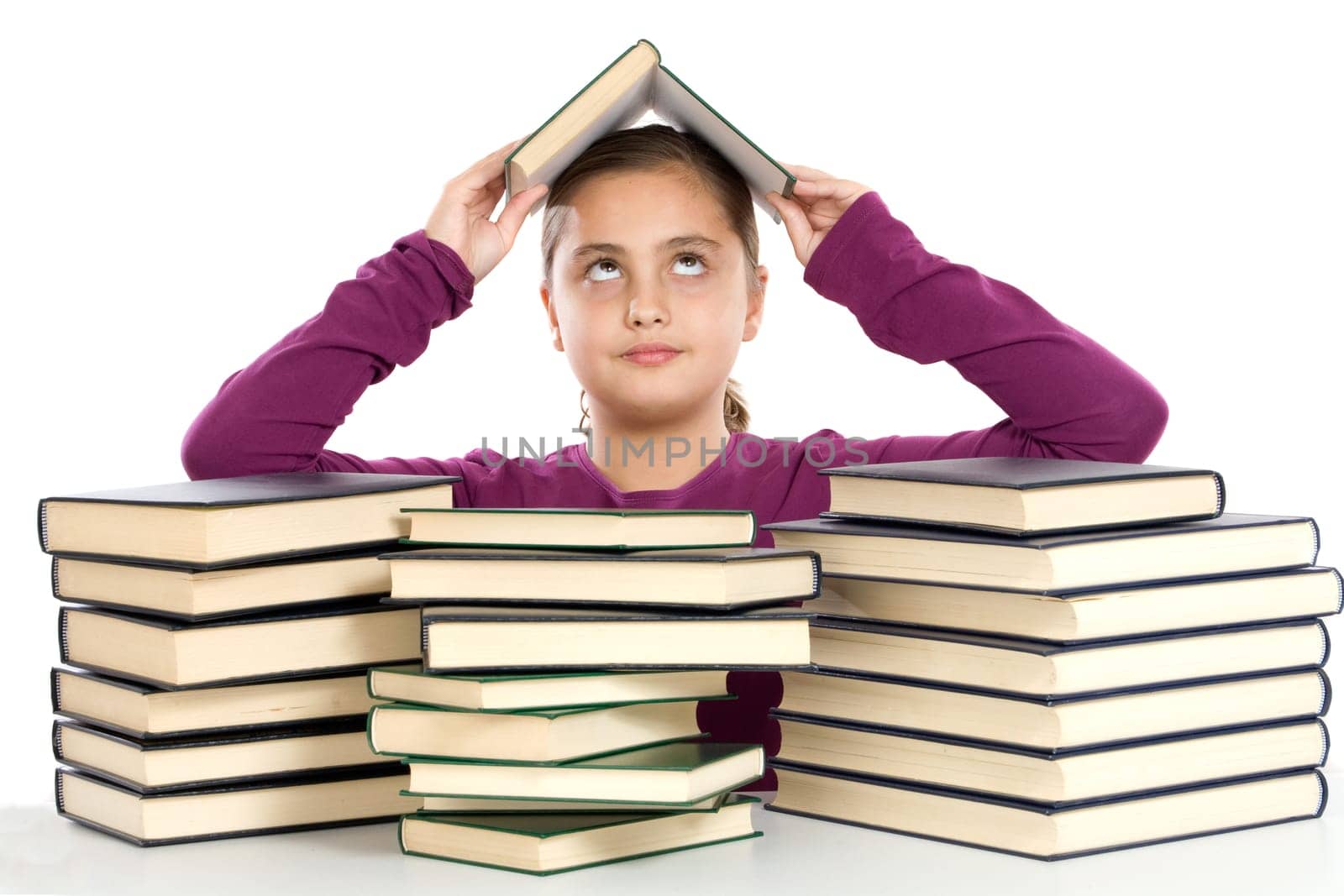 Adorable girl with many books