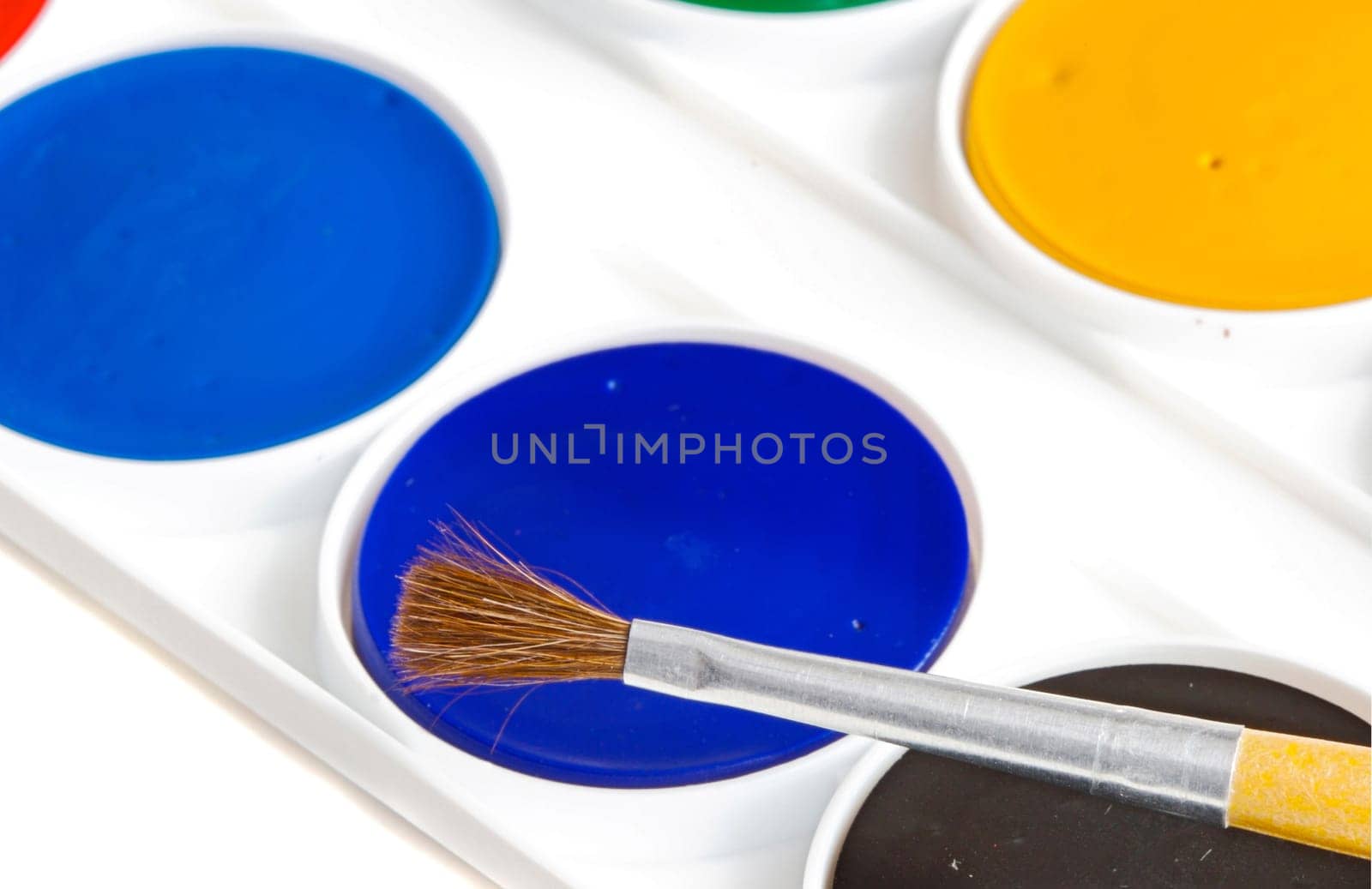 Box of watercolors with brush