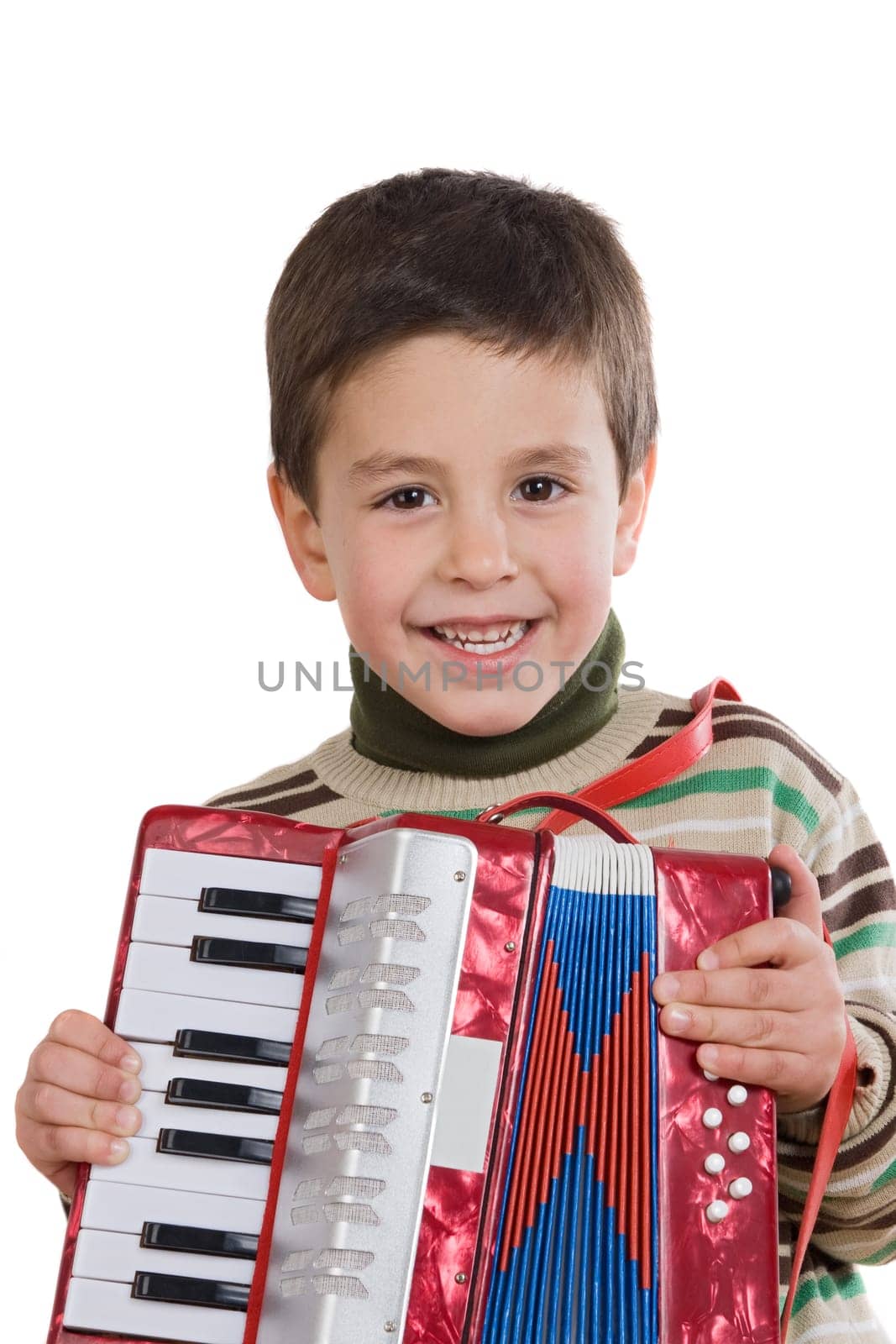 Adorable child playing red accordion