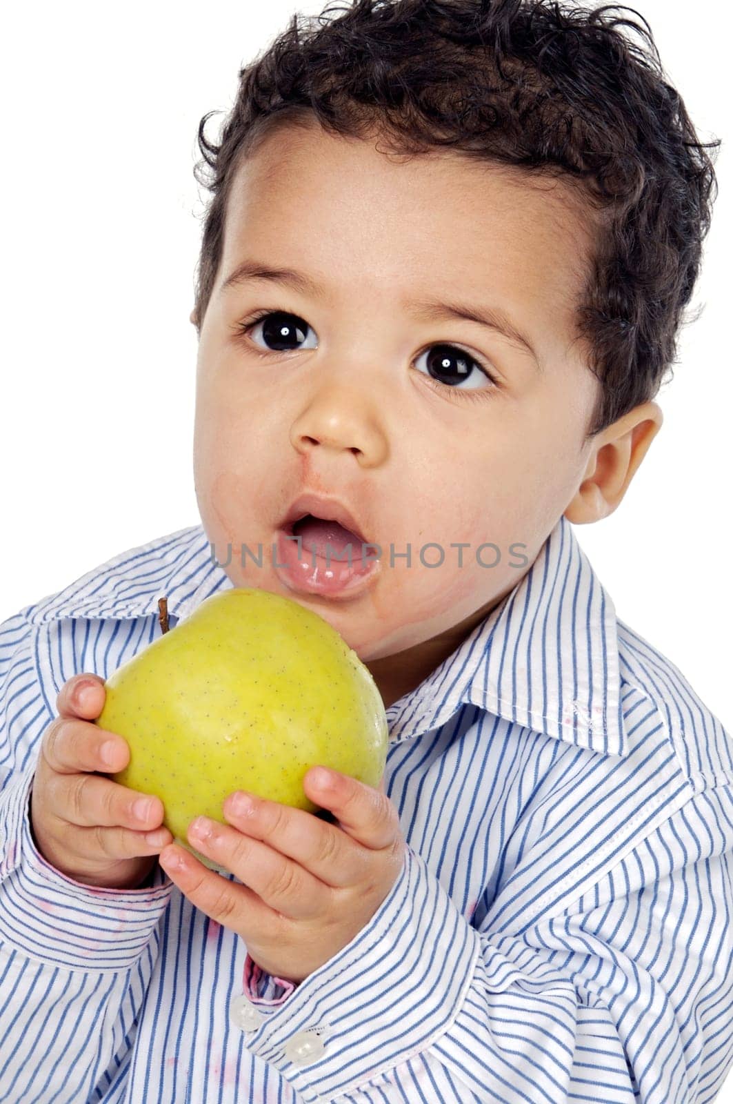 Small baby eating an apple