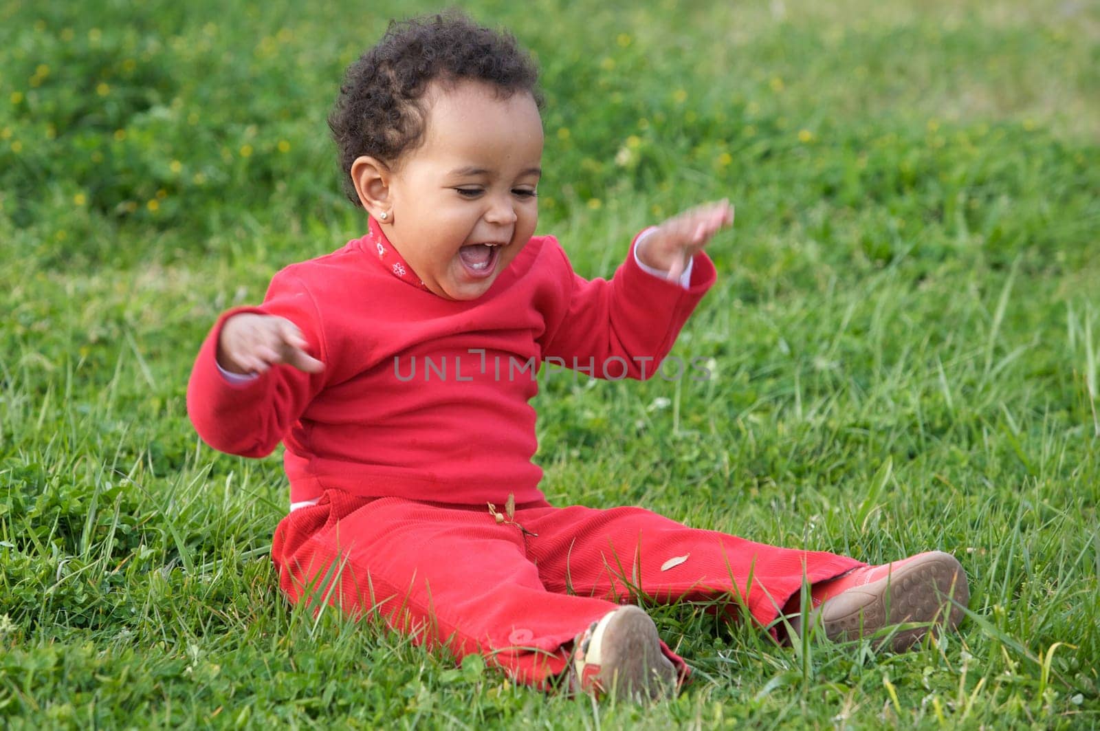 Baby playing on the grass