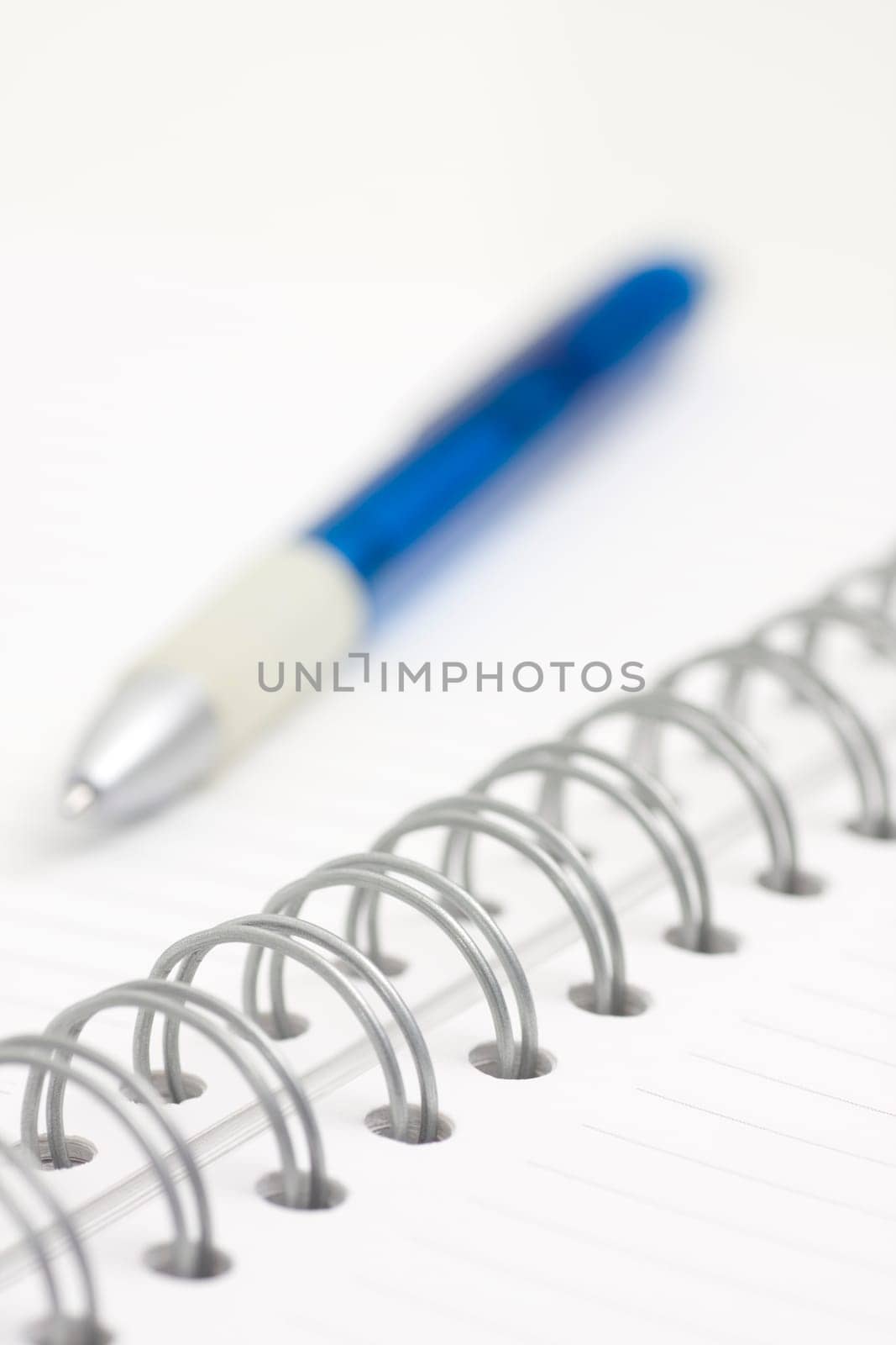 pen on spiral notebook