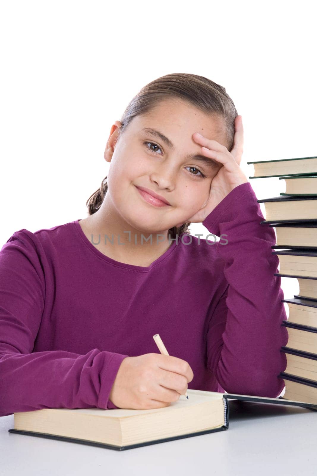 girl concentrated with many books