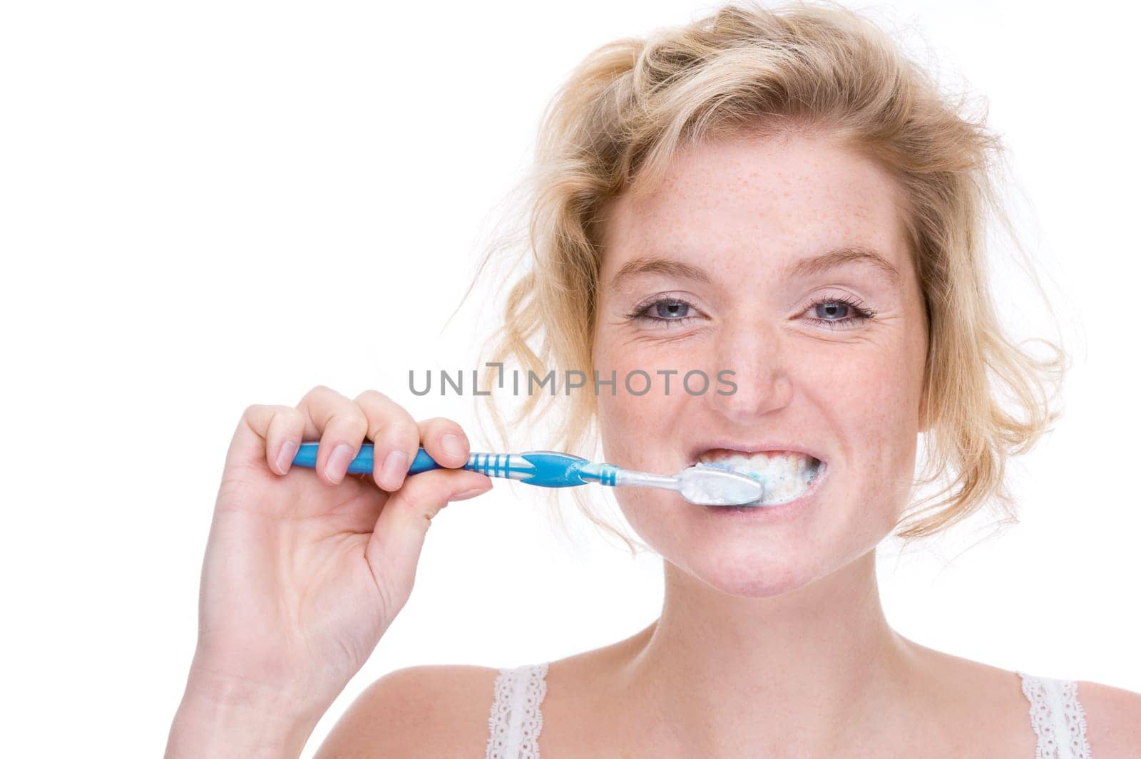 Young woman brushing her teeth