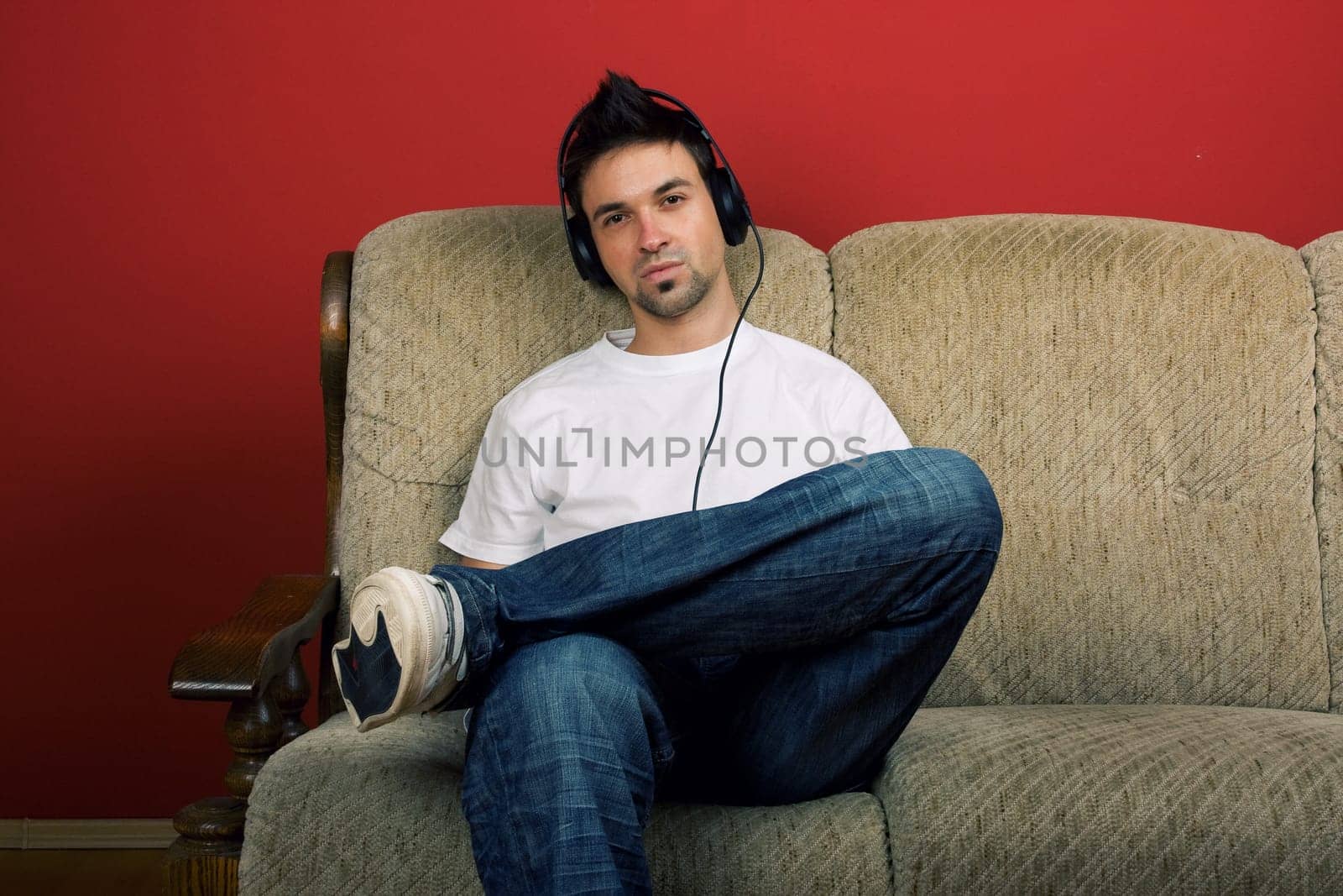 Sitting young man listening music