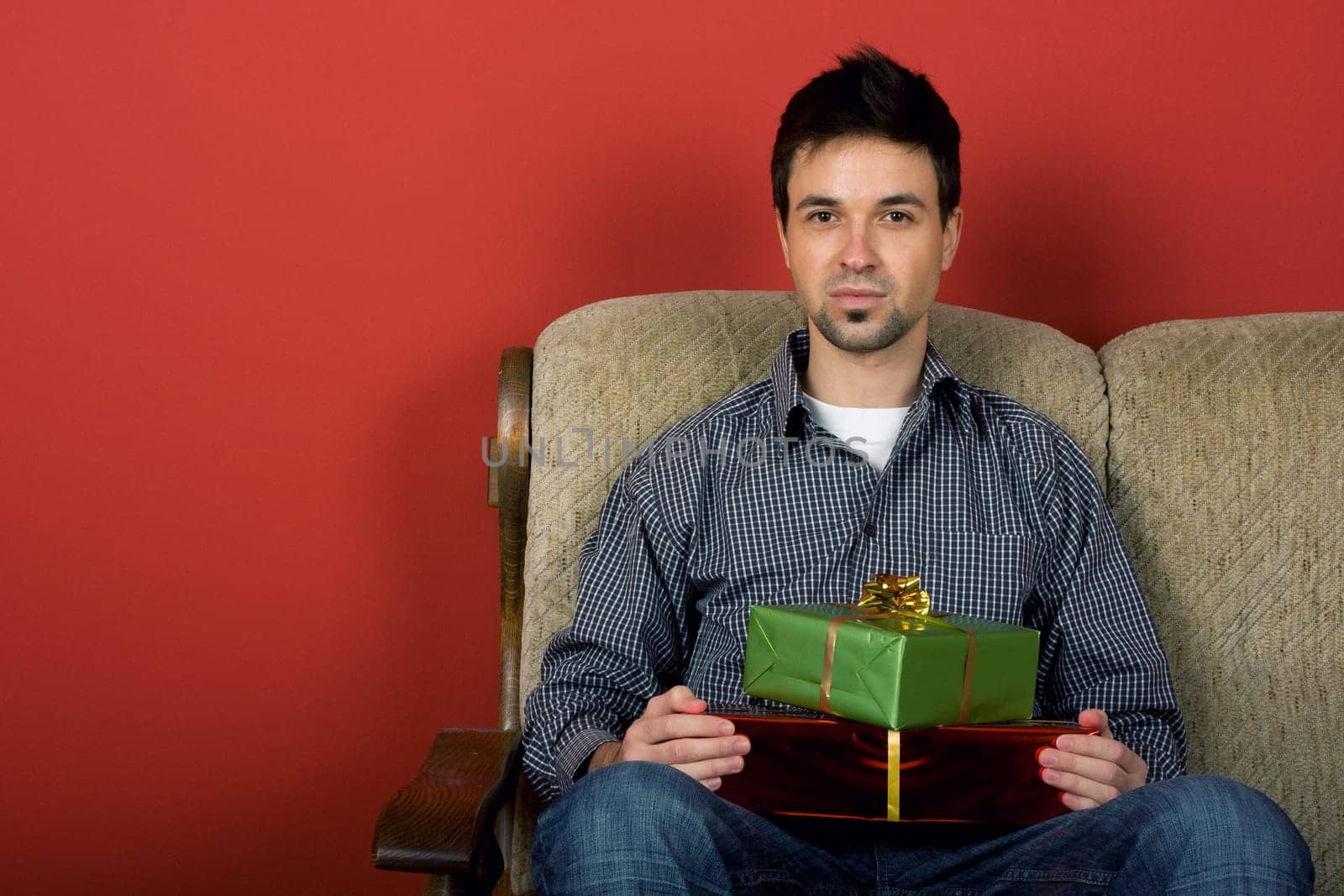 Sitting man with gift
