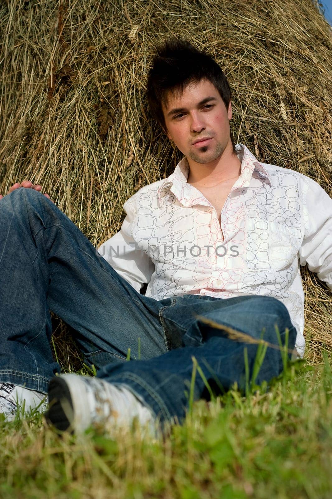 Young Man relaxing on the hay