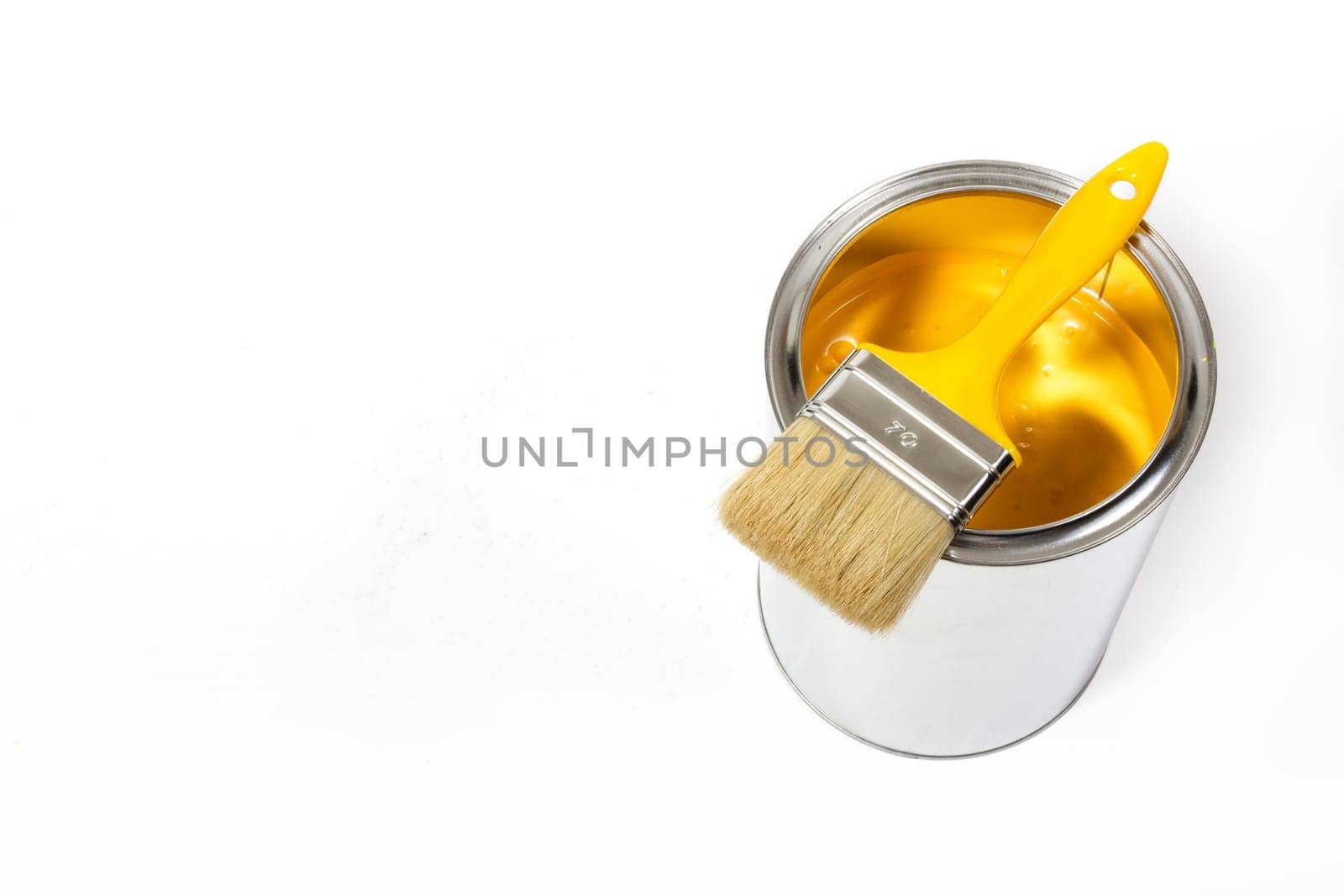 Yellow paint can with brush isolated