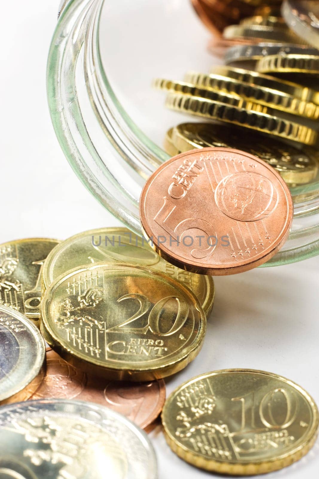 A jar with some small Euro coins inside