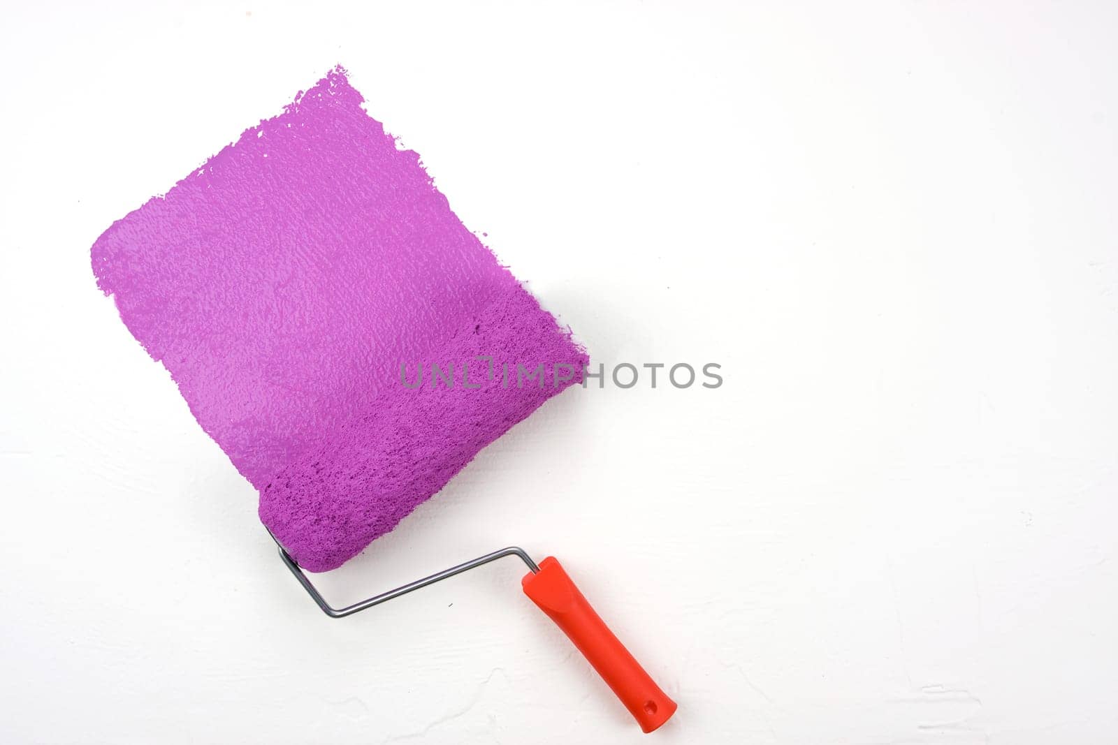 Magenta paint roller with clipping path