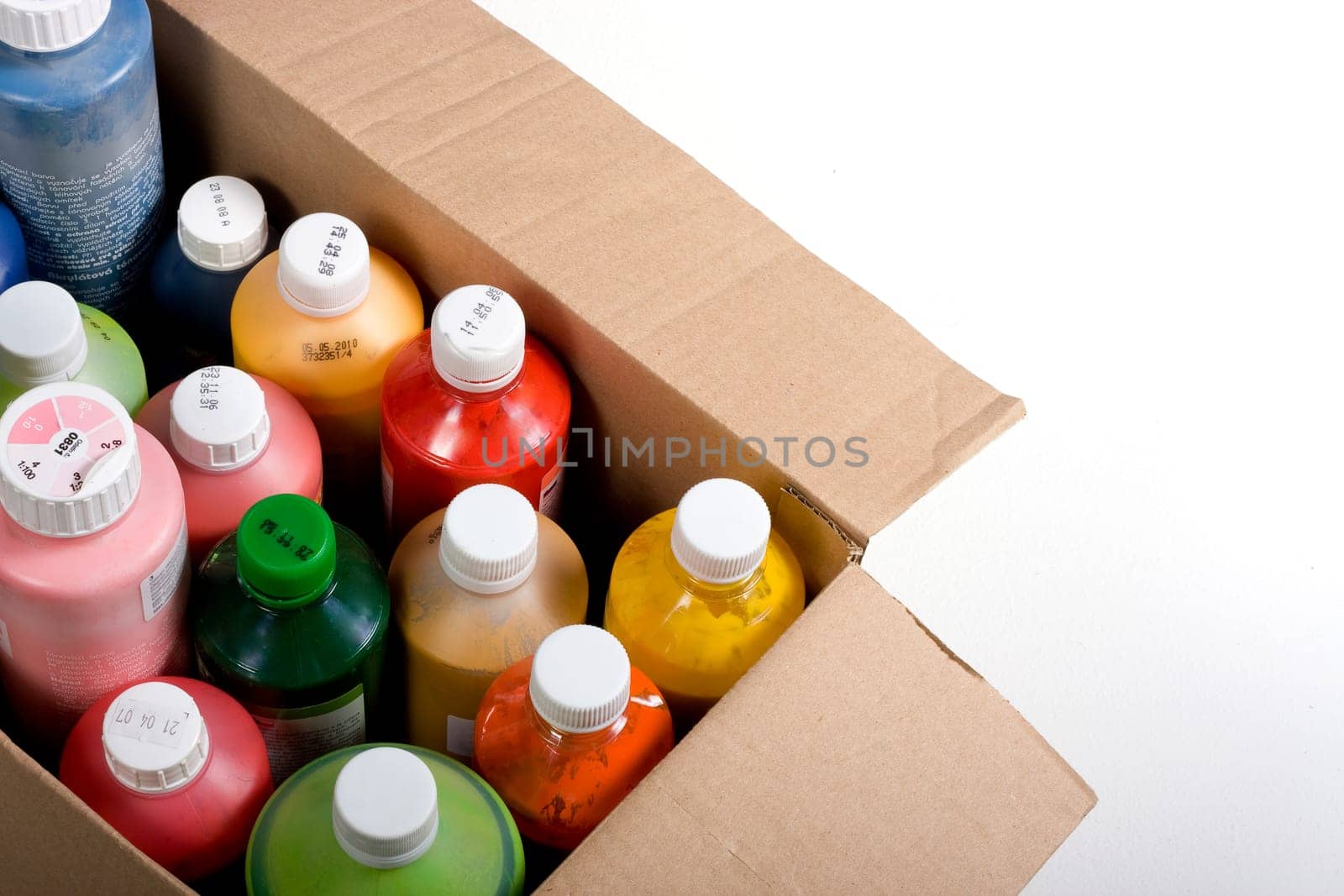 Colorful paint plastic bottle in carton