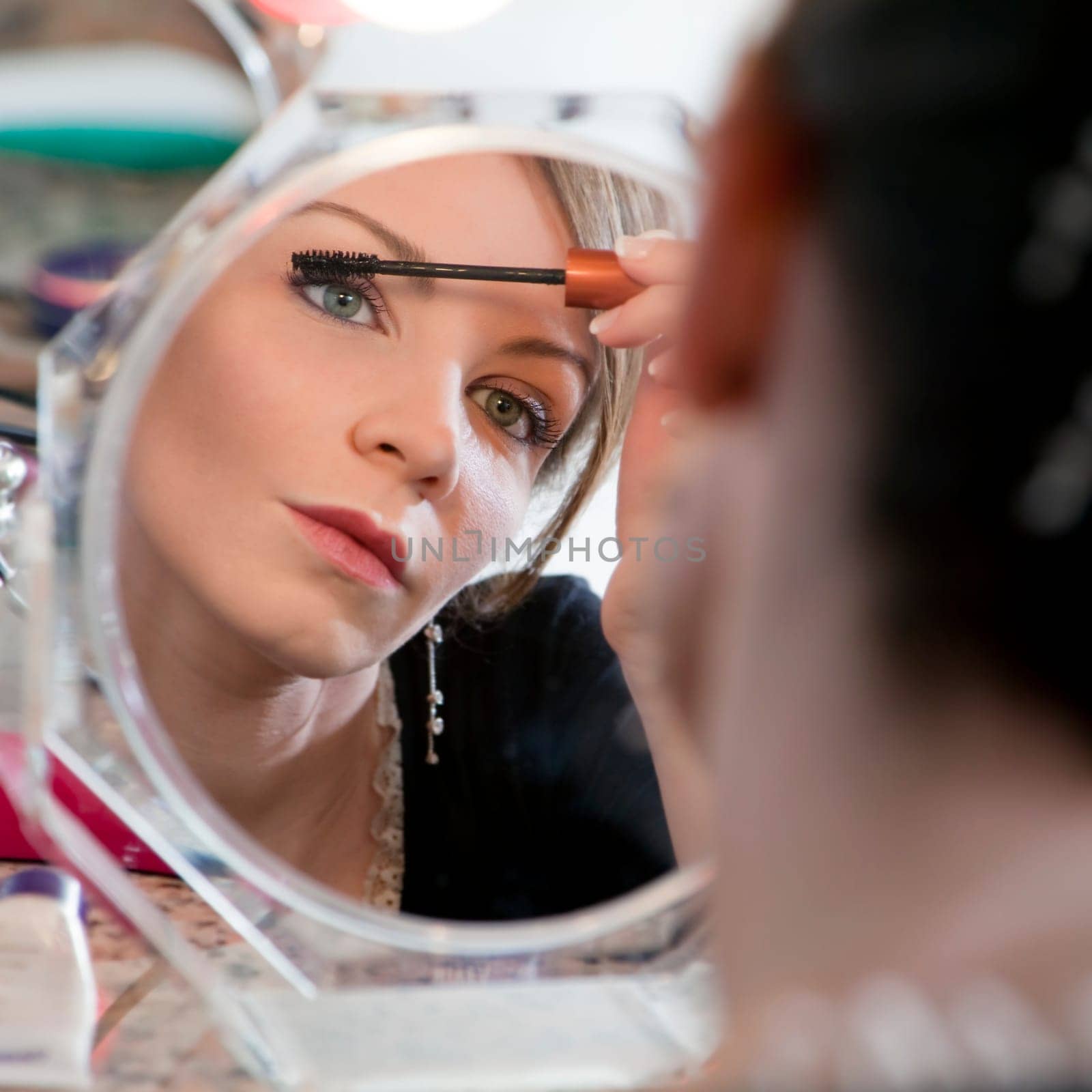 woman looking at mirror