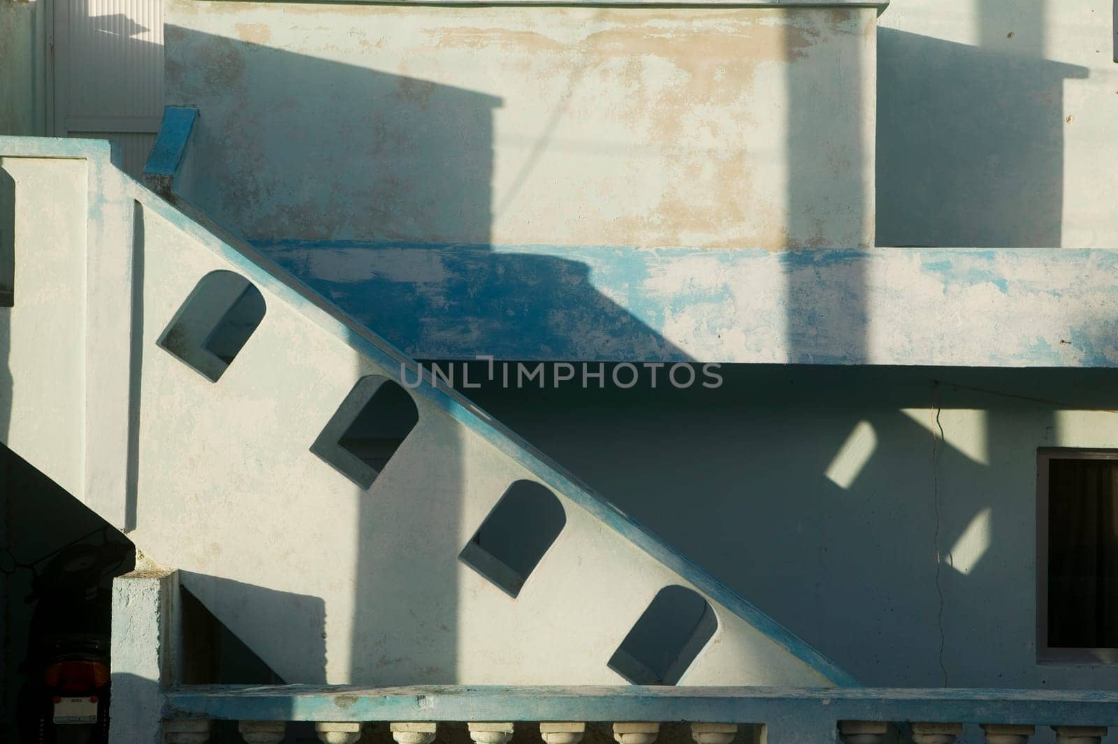 Stairs, Blue Walls and Tropical Sunrise