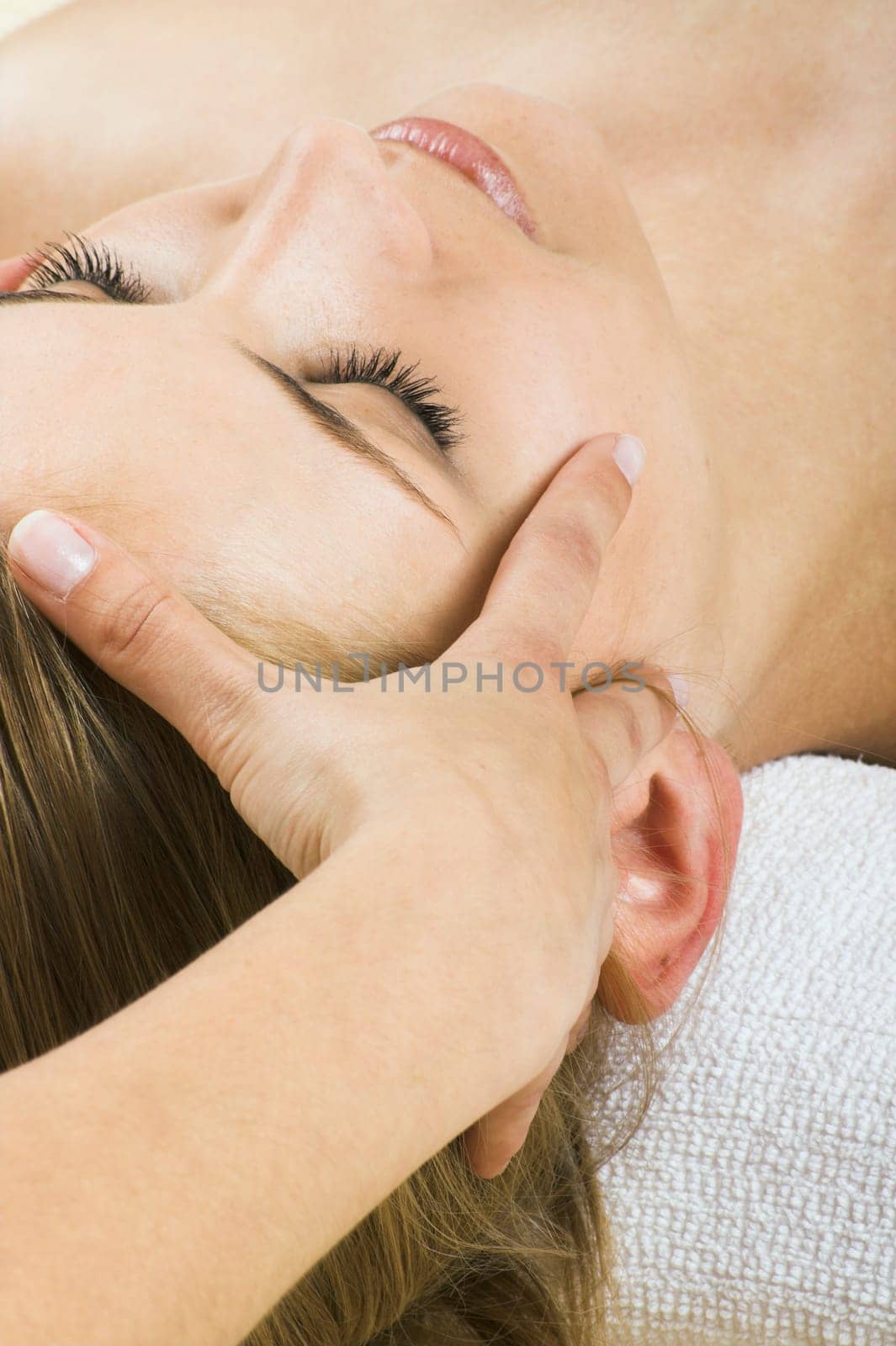 young woman having a facial massage