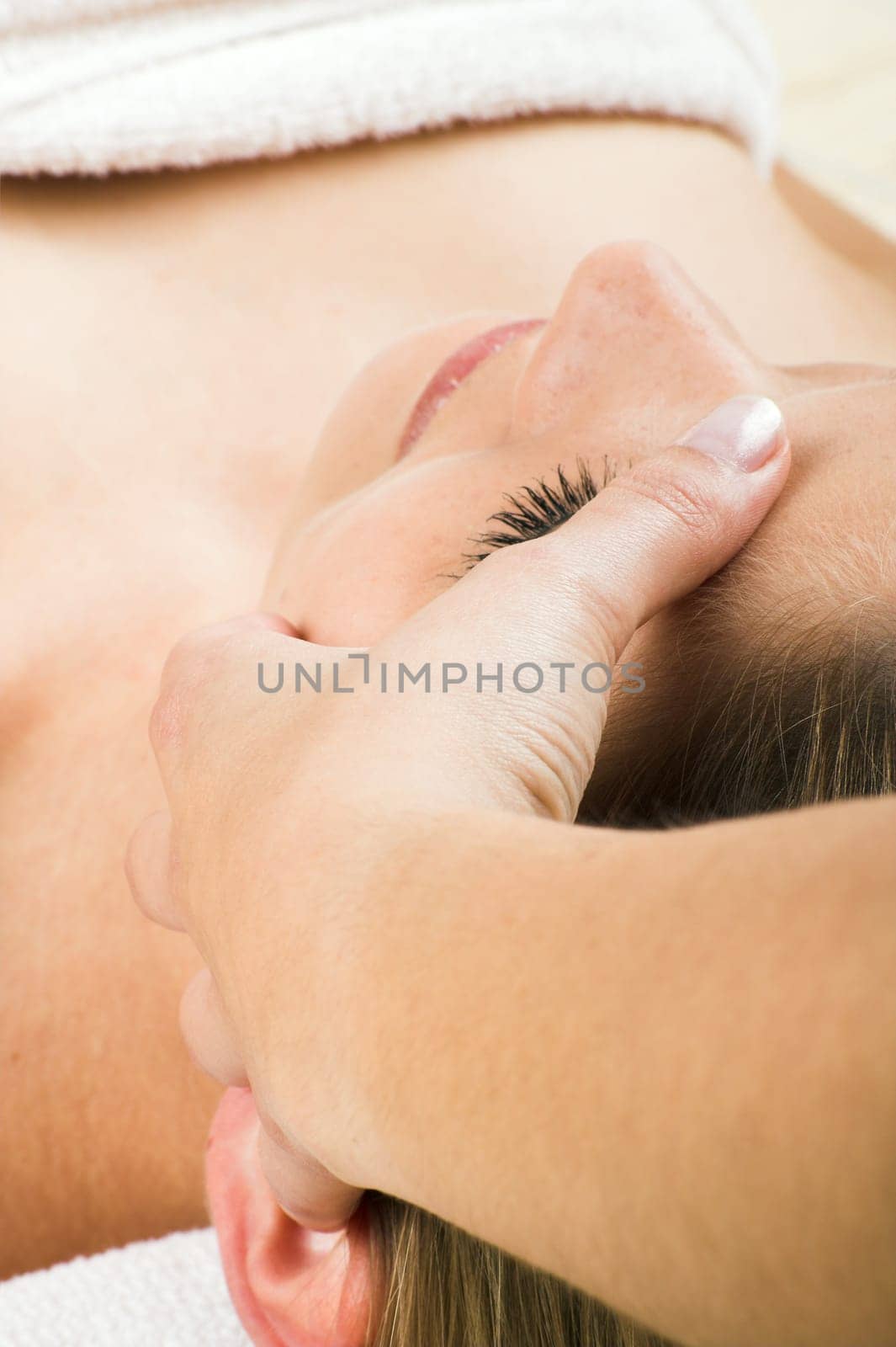 young woman having a facial massage